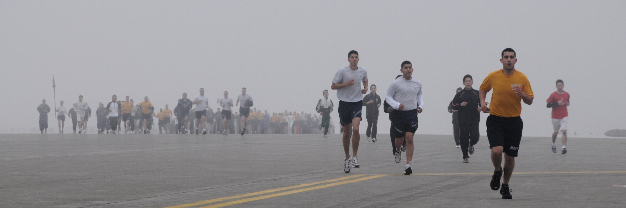MISAWA AIR BASE, Japan -- Airmen, Soldiers, Sailors and members of the Japan Air Self-Defense Force start the first readiness run of the year May 8, 2009. Runners had the option of a two- or four-mile course on the flightline. (U.S. Air Force photo by Senior Airman Jamal Sutter)