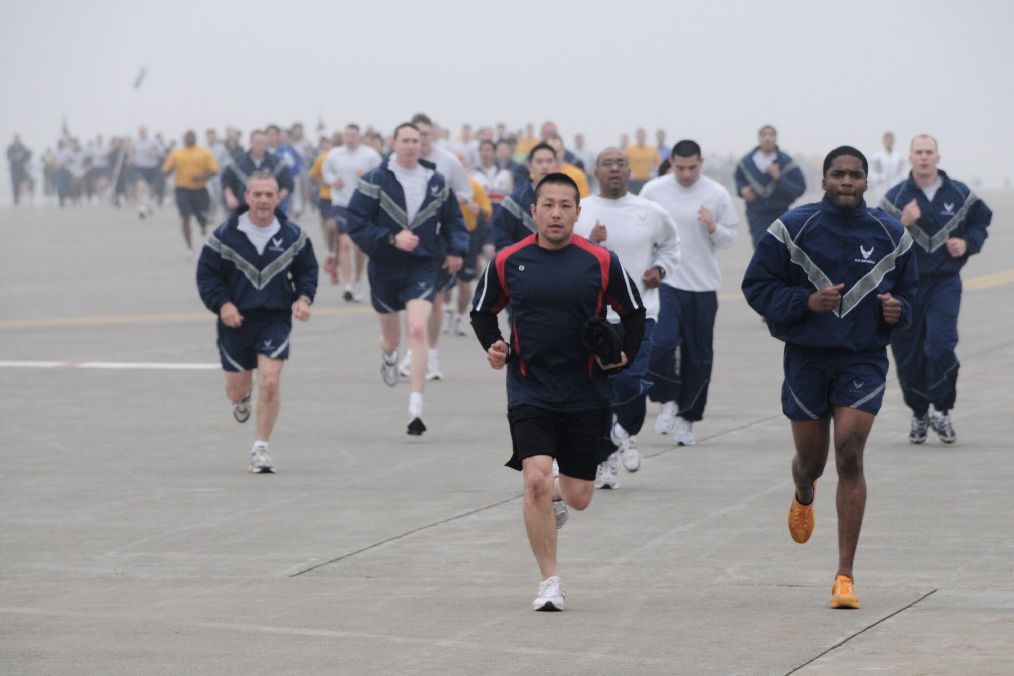 MISAWA AIR BASE, Japan -- Airmen, Soldiers, Sailors and members of the Japan Air Self-Defense Force run on the flightline May 8, 2009. The run was the first readiness run of the year. (U.S. Air Force photo by Senior Airman Jamal Sutter)