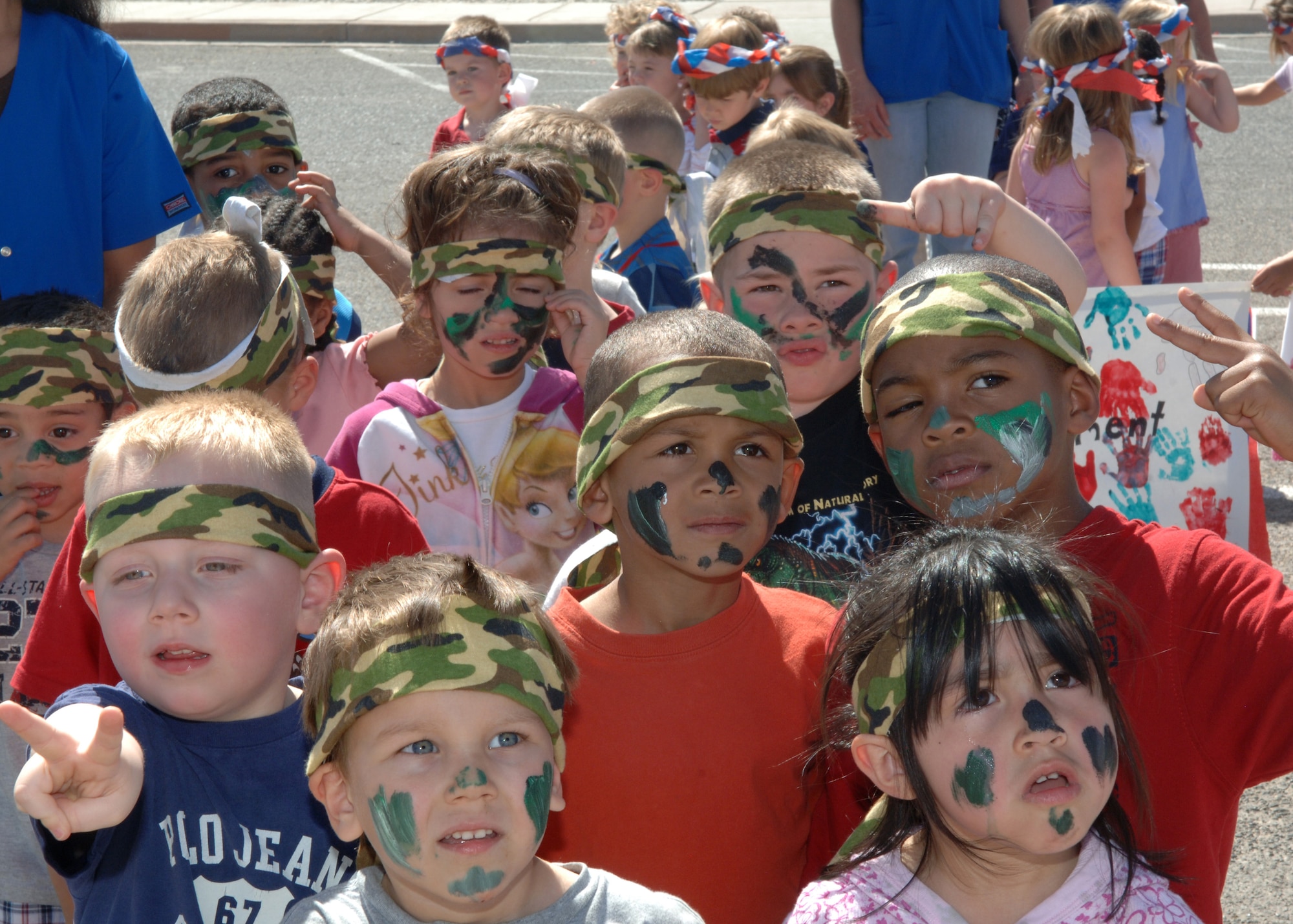 Camouflaged in bandanas and face paint, Pre-K students participate in the yearly Military Child Parade at Holloman Air Force Base, N.M., April 30. To celebrate month of the Military Child, children of all ages dressed up to march in this year?s parade hosted by the Child Development Center. (U.S. Air Force photo/ Airman 1st Class Veronica Stamps)