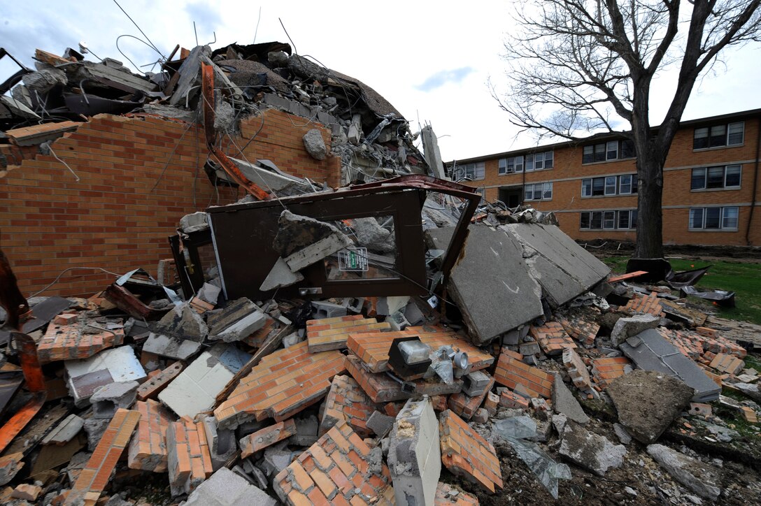 The Juniper Inn dorms get systematically demolished by Quinn Construction here, May 6. The dorms are being torn down to reduce energy costs at Ellsworth and are expected to be completely demolished by July 2009. This demolition effort is part of both Air Combat Command’s and the Air Force’s goal of reducing 20 percent of real property square footage and 20 percent of maintenance costs by the year 2020. (U.S. Air Force photo/Airman 1st Class Corey Hook)