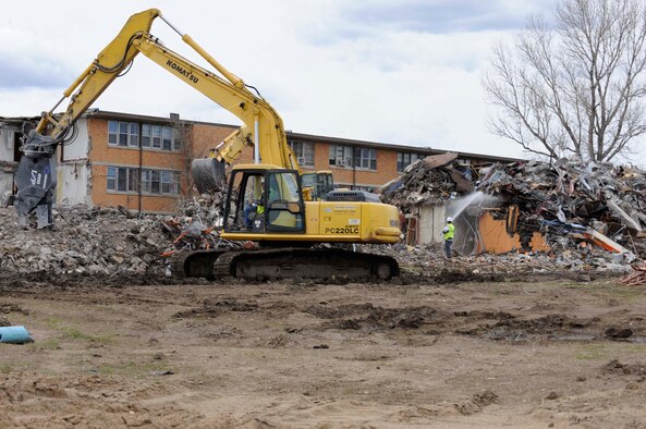 The Juniper Inn dorms get systematically demolished by Quinn Construction here, May 6. The dorms are being torn down to reduce energy costs at Ellsworth and are expected to be completely demolished by July 2009. This demolition effort is part of both Air Combat Command’s and the Air Force’s goal of reducing 20 percent of real property square footage and 20 percent of maintenance costs by the year 2020. (U.S. Air Force photo/Airman 1st Class Corey Hook)