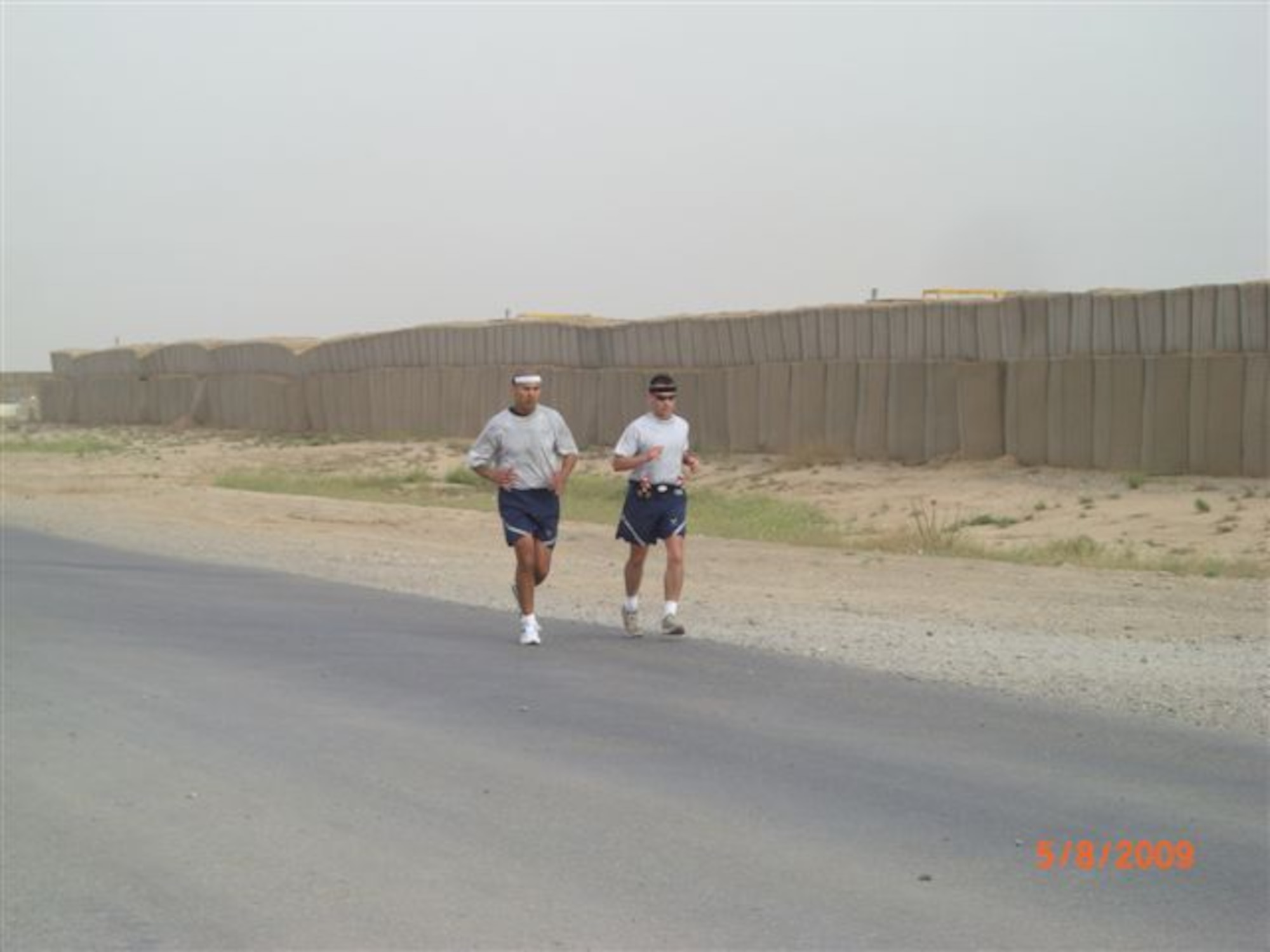 Staff Sgt. Sonny Hernandez, of the 445th Security Forces Squadron and Tech. Sgt. Sam A. Ruiz, of the 119th Wing Security Forces Squadron run in the Fargo Marathon from Iraq on May 9th.  