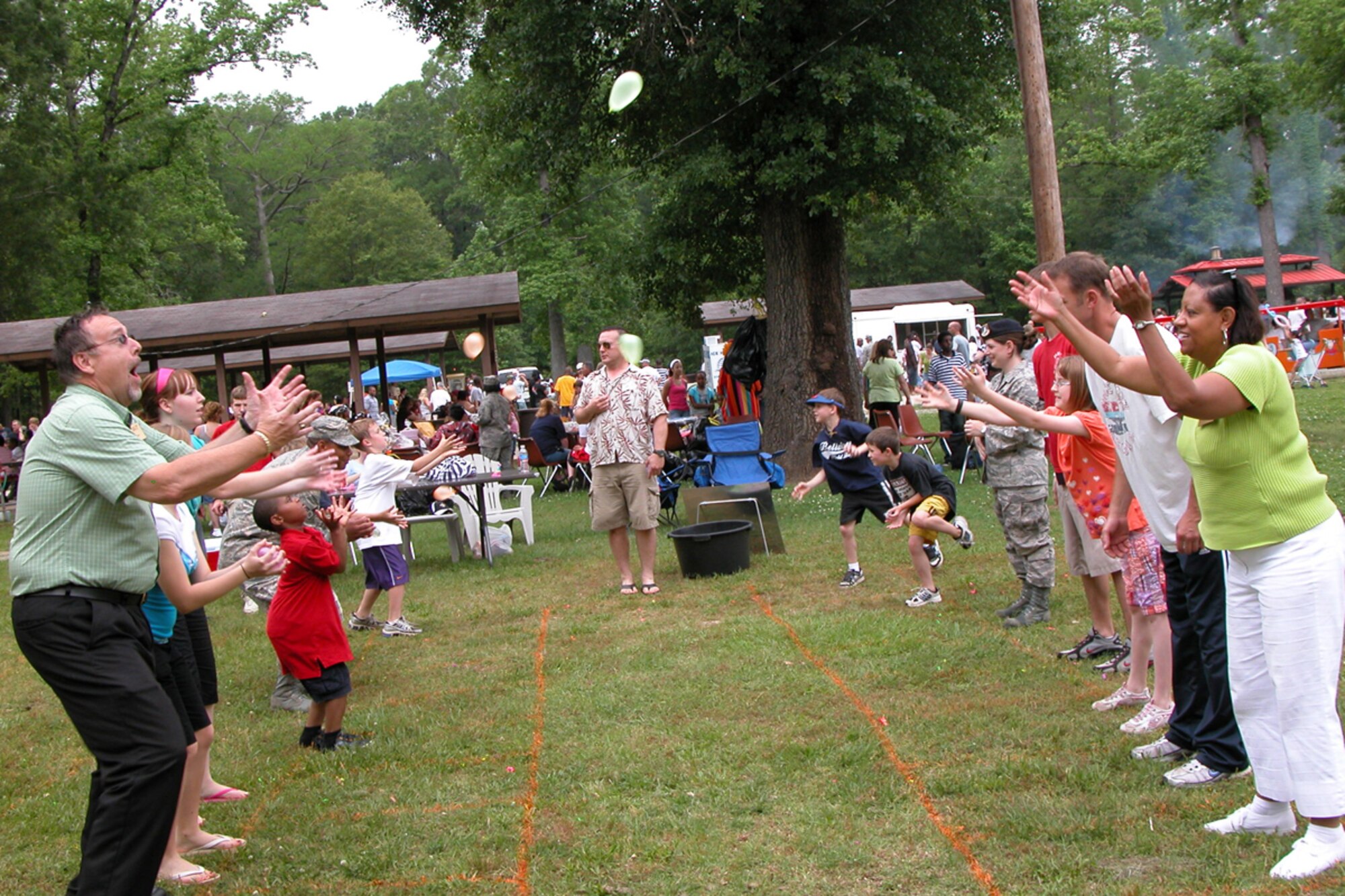 Participants in the 917th Wing’s Family Day celebration at Barksdale Air Force Base, La., May 2, 2009, try their hands at the balloon toss. The celebration is an annual event in conjunction with a golf tournament at the Fox Run Golf Course. (US Air Force photo/Betty Stephens)