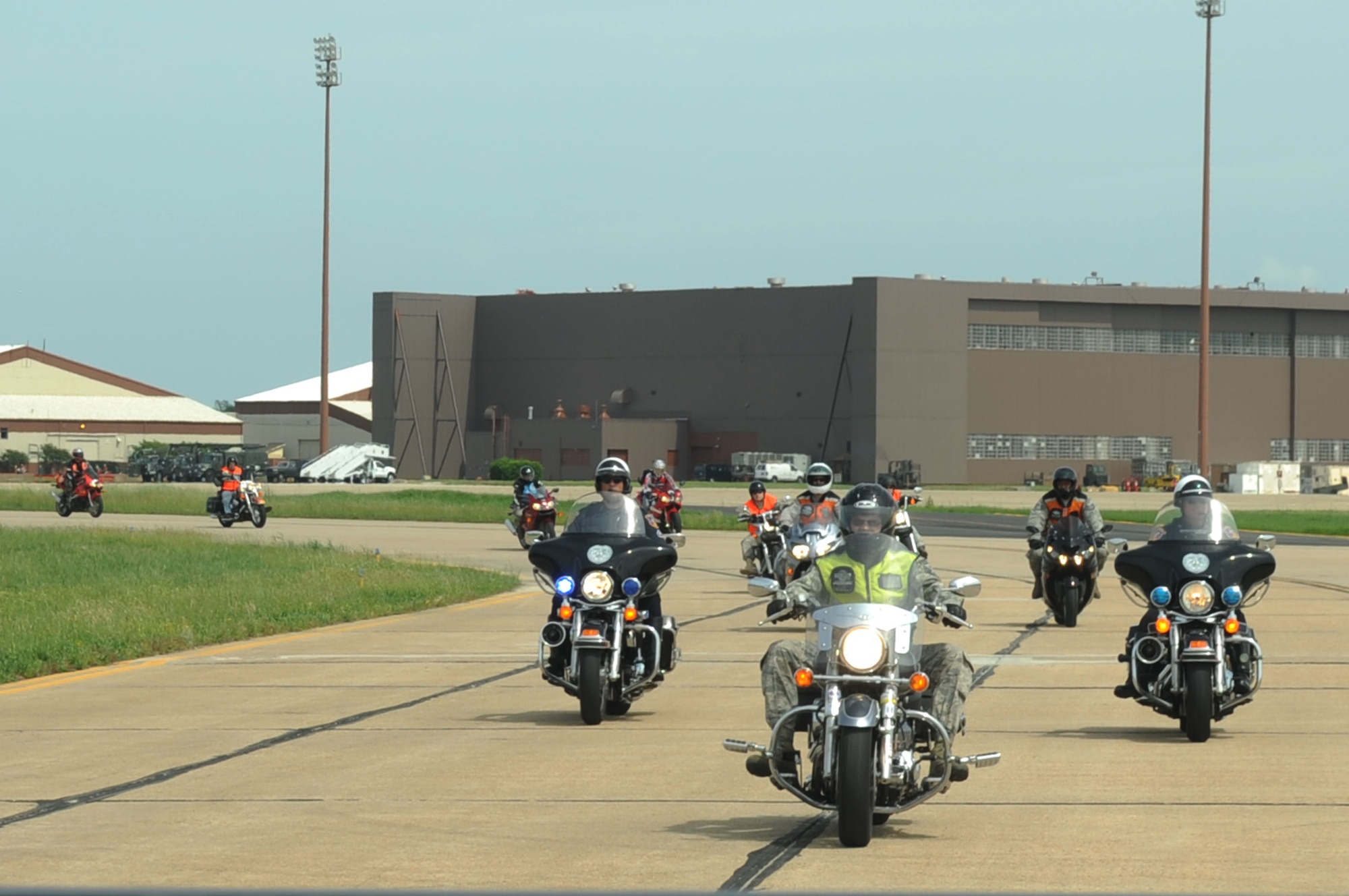 LANGLEY AIR FORCE BASE, Va. -- Airmen participate in a motorcycle slow run down the runway during the annual motorcycle safety day here May 8. The annual event is a command directed event for the 101 Critical Days of Summer that ensures motorcyclists practice the rules of the road. (U.S. Air Force photo/Senior Airman Ashley Hawkins)
