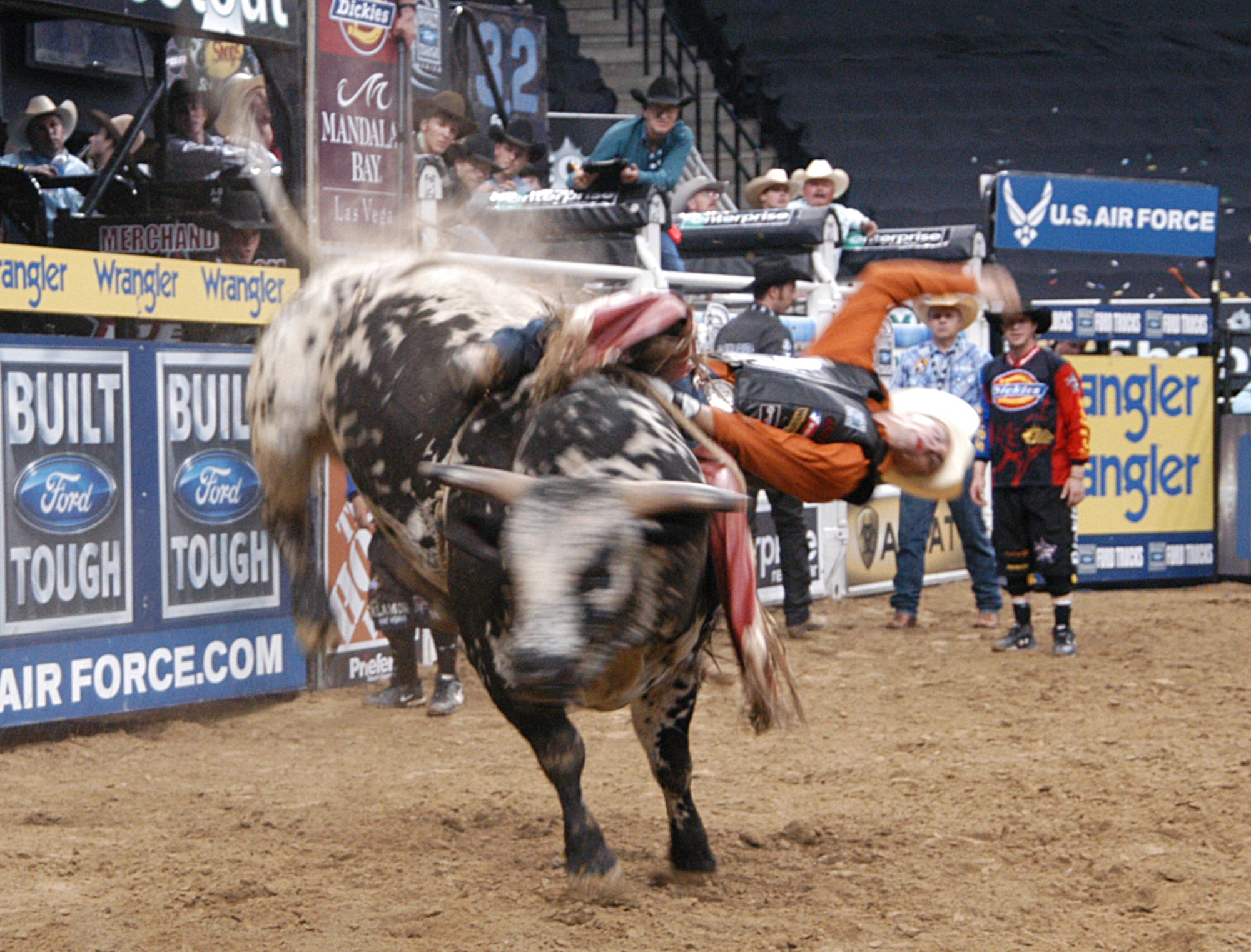 A bull rider with the Professional Bull Riders, Inc. is thrown from his bull during an event at the Quest Center April 24, in Omaha, Neb. The U.S. Air Force is a sponsor of PBR. (U.S. Air Force photo/Tech. Sgt. David McCarrison)