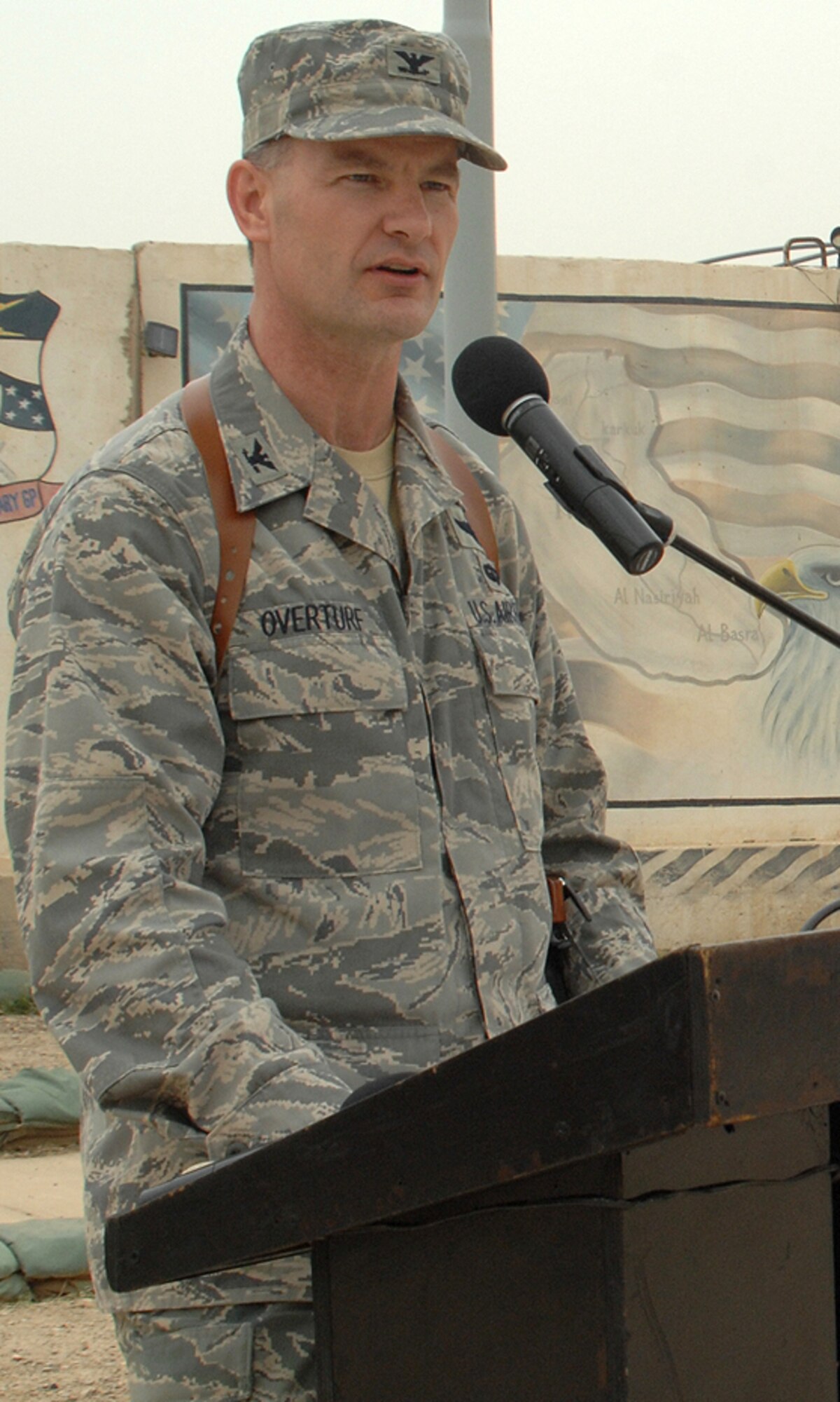 Col. Eric S. Overturf speaks to the men and women of the 506th Air Expeditionary Group at Kirkuk Regional Air Base, Iraq, after assuming command of the group April 30, 2009. Colonel Overturf is an Air Force reservist who commanded the 477th Fighter Group, an F-22 classic associate unit, at Elmendorf Air Force Base, Alaska, before deploying to Iraq. (U.S. Air Force photo/Staff Sgt. Eunique Stevens)