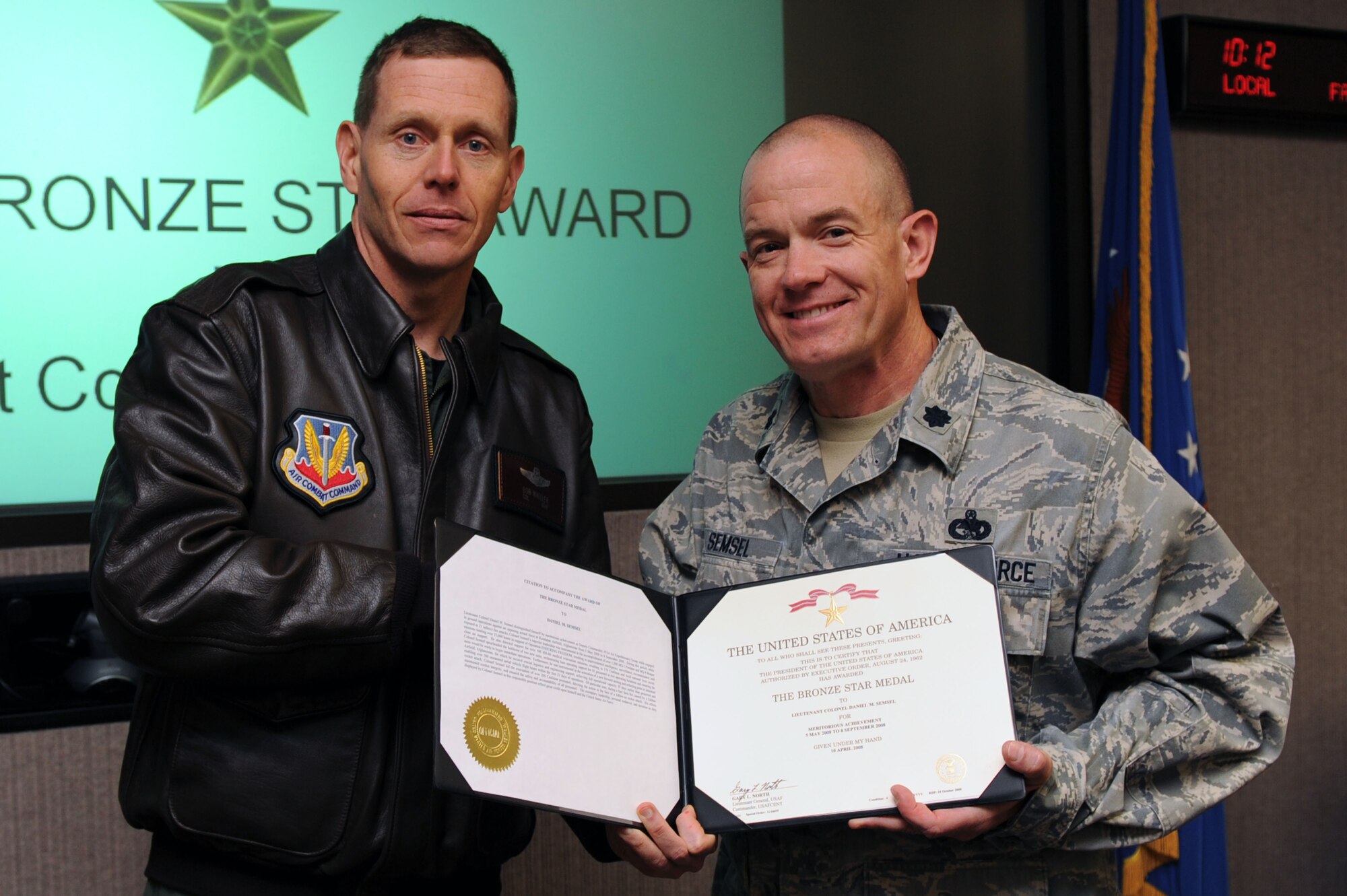 WHITEMAN AIR FORCE BASE, Mo. -- Lt. Col. Daniel Semsel, 509th Mission Support Group deputy commander (right) is awarded a Bronze Star medal by Col. Robert Wheeler, 509th Bomb Wing commander, for meritorious achievement May 6 at the 509th Bomb Wing headquarters.  The award was given for leadership in accomplishing more than 1200 unmanned aerial system sorties against an opposing armed force at Kandahar Airfield, Afghanistan from May to Sept., 2008. (US Air Force photo/Senior Airman Jason Huddleston)