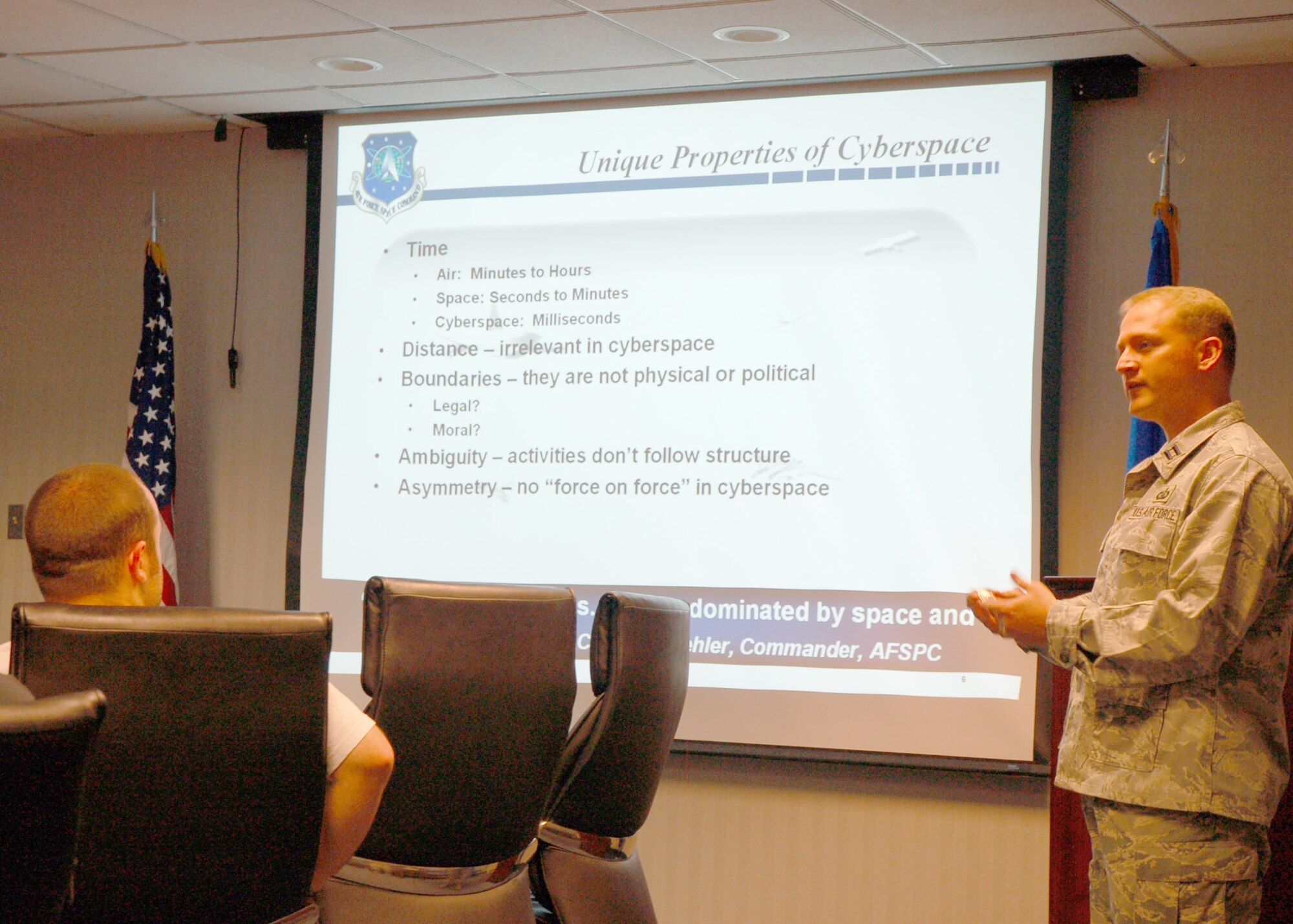 Capt. Jon Boling, Chief, Air Force Cyber Command (Provisional) Commander's Action Group, briefs a group of students from Louisiana Tech University in Ruston, Louisiana, about current threats in cyberspace. The students visited AFCYBER (P) May 5 as a follow up to a recent course, "Studies in Cyberspace," and to learn more about the military's current cyber efforts. (U.S. Air Force Photo/Carla Pampe)