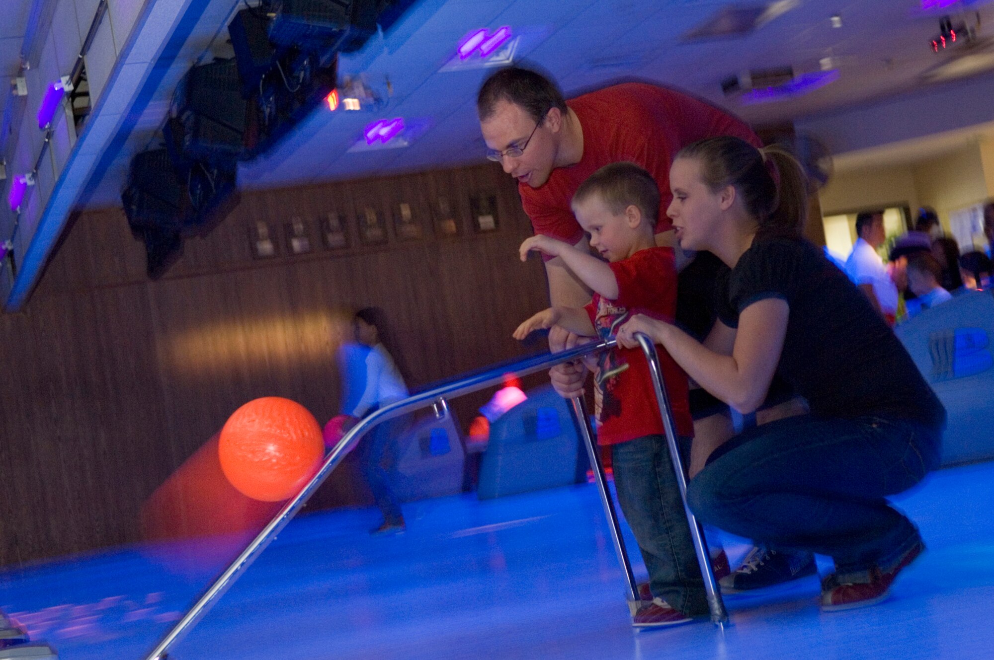 HANSCOM AIR FORCE BASE, Mass. – A family enjoys a game of bowling during the 66th Services Squadron’s Bop ‘n’ Bowl event on May 9. The event included musical entertainment by the Toe Jam Puppet Band, activities and fun for the entire family. (U.S. Air Force photo by Mark Wyatt)