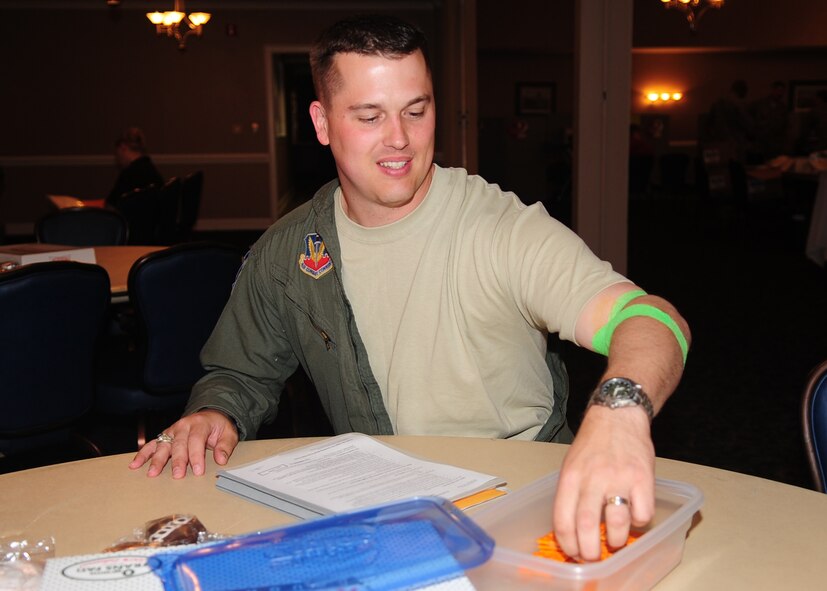 Major Todd Sprister, 4th Operations Support Squadron, snacks on crackers after donating blood to the Red Cross at Seymour Johnson Air Force Base, N.C., May 7, 2009. Consuming a light snack after donating blood raises blood sugar to help prevent blackouts. (U.S. Air Force photo by Airman 1st Class Rae Perry)