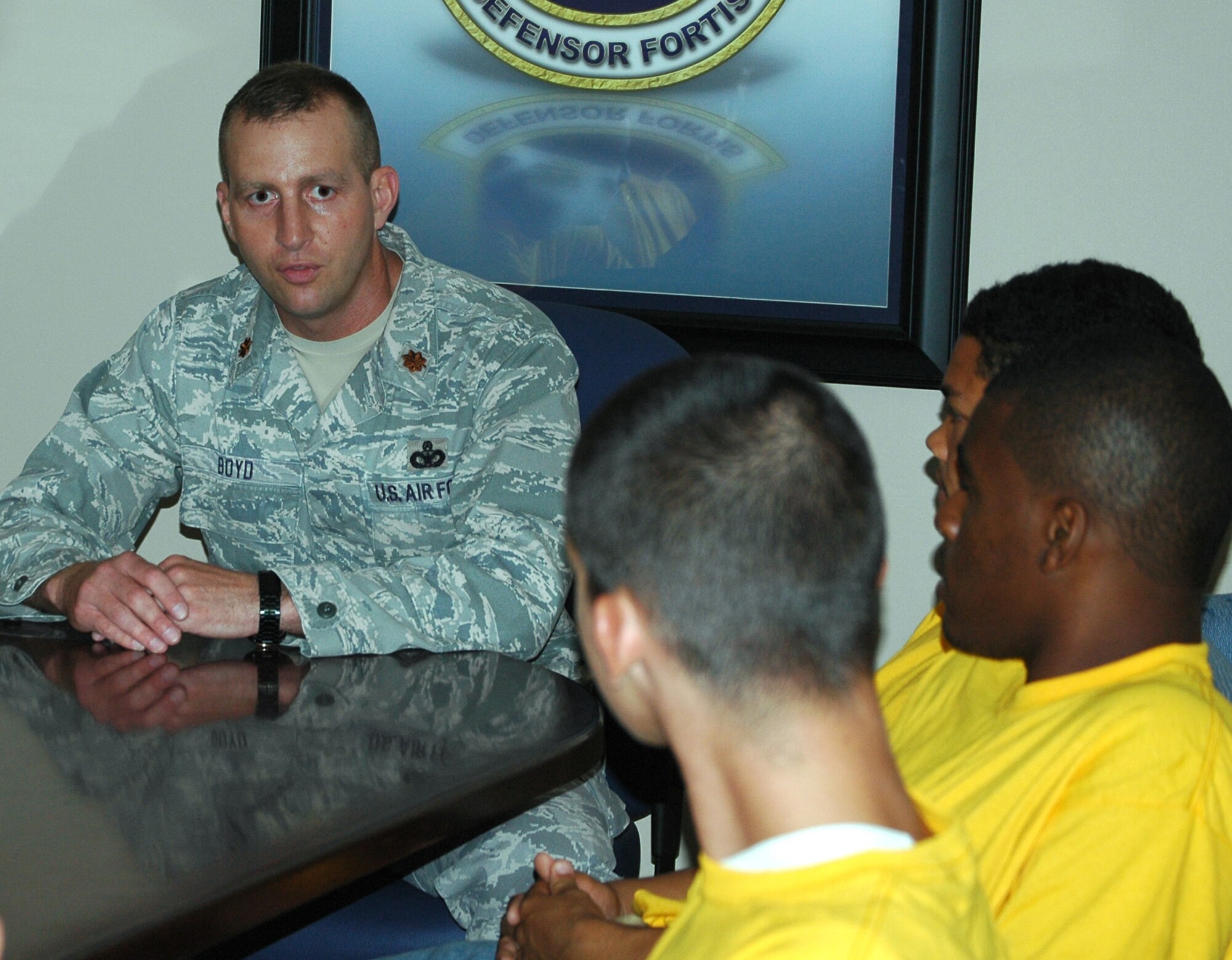 Maj. Woody Boyd talks to teenagers from the Liberty Juvenile Unit for Special Treatment facility about the mission of the 325th Security Forces Squadron May 5 at Tyndall Air Force Base, Fla. Airmen hosted the teens for a day, showed them the base and mentored the youths. Major Boyd is the 325th SFS commander. (U.S. Air Force photo/Staff Sgt. Joshua Stevens) 
