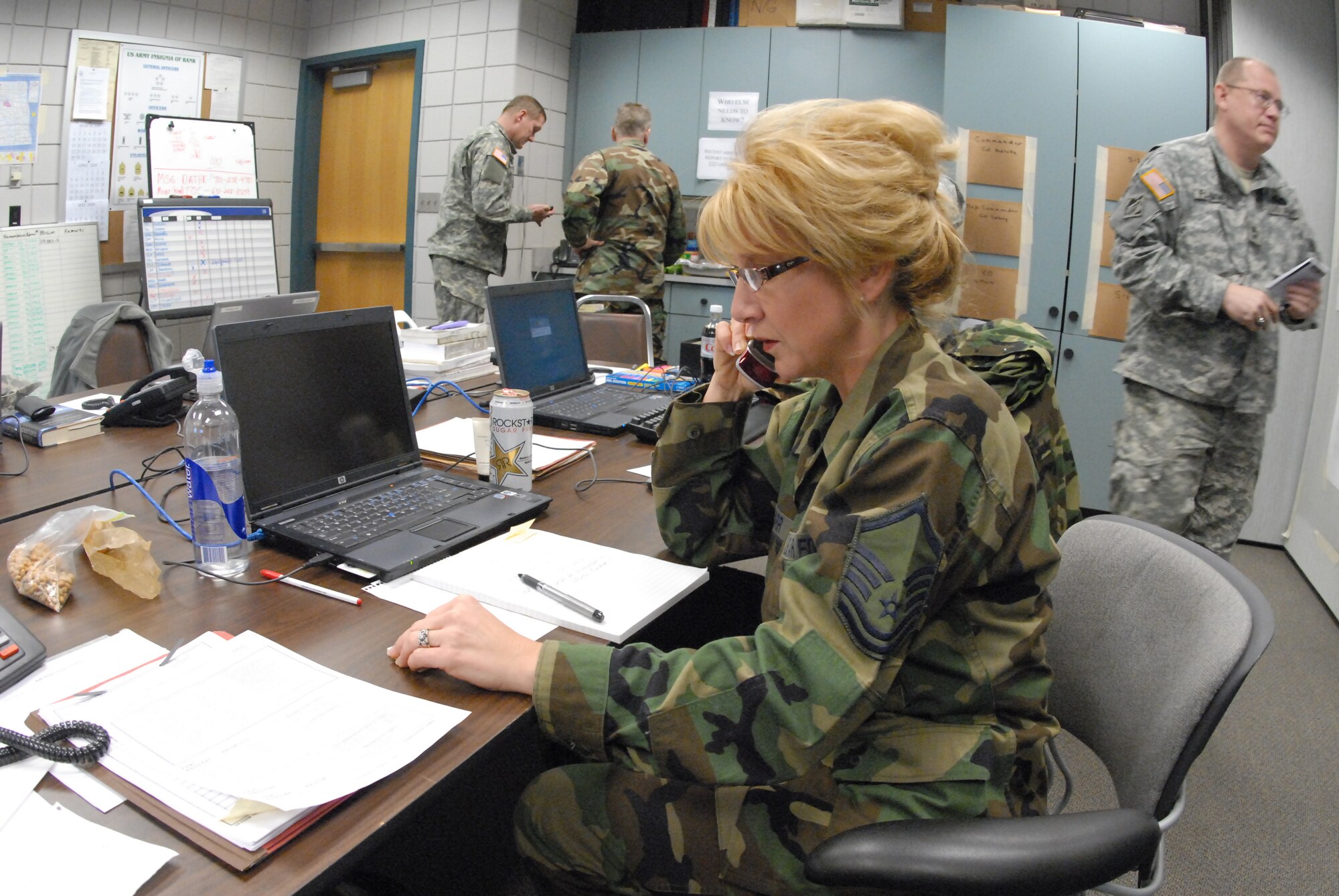 Master Sgt. Kim Harr, 119th Wing, works at the Joint Task Force-East command center during 2009 flood operations in the Red River Valley. 