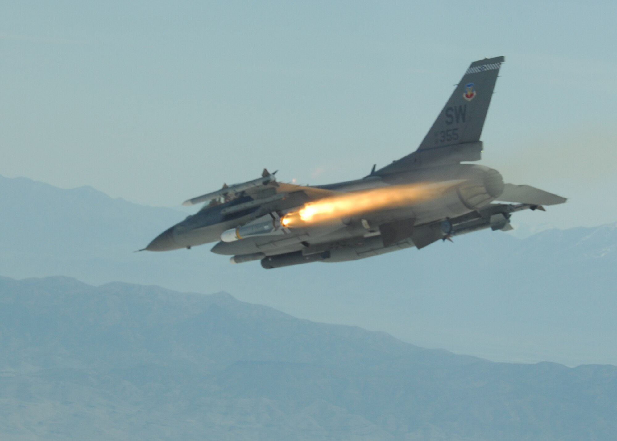 An F-16 from the 55th Fighter Squadron from Shaw Air Force Base, S.C. fires an AGM-65 at a ground target during a Combat Hammer mission during a two-week large-scale evaluation. Combat Hammer is also known as a Weapons System Evaluation Program for air-to-ground weapons.  Almost every fighter in the Air Force inventory participated in the evaluation held at Hill Air Force Base, Utah, which also included bombers and unmanned aircraft systems.  The 86th Fighter Weapons Squadron executes the 'Hammer' missions by evaluating the entire weapons process from loading to flight to the target.  (U.S. Air Force photo/Capt. Amber House.)