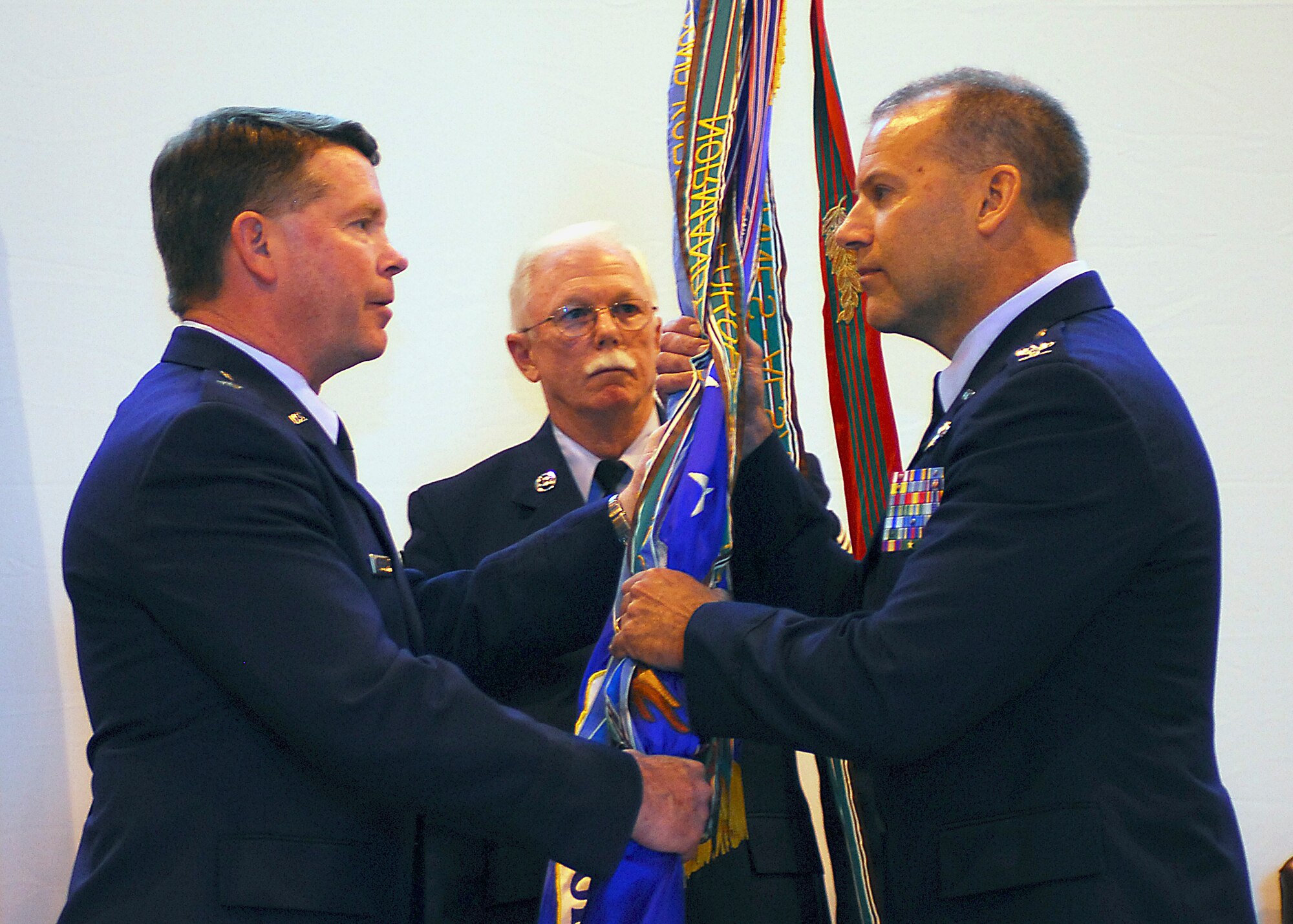 Colonel Kenneth Nereson, right, accepts the guidon from Brigadier General John Nichols as he assumes command of the 149th Fighter Wing, Texas Air National Guard, Lackland AFB, Texas on April 17, 2009. (Air National Guard photo by SSgt Eric Wilson) (RELEASED)