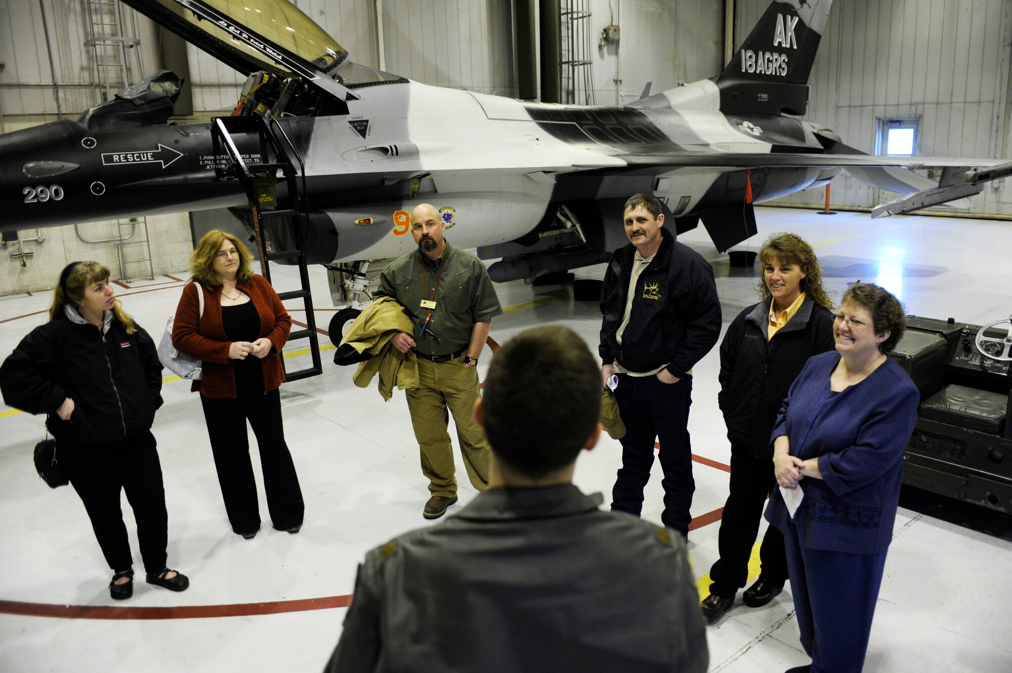 Maj. Jeff Simmons, 18th Aggressor Squadron pilot, talks about the F-16 Aggressor capability May 6, 2009, Eielson Air Force Base, Alaska. Seven local teachers selected for the teacher spotlight program were given a in-depth tour at the 18th Aggressor Squadron and 354th Security Forces Squadron Military Working Dog Kennels.  (U.S. Air Force Photo/Senior Airman Jonathan Snyder)