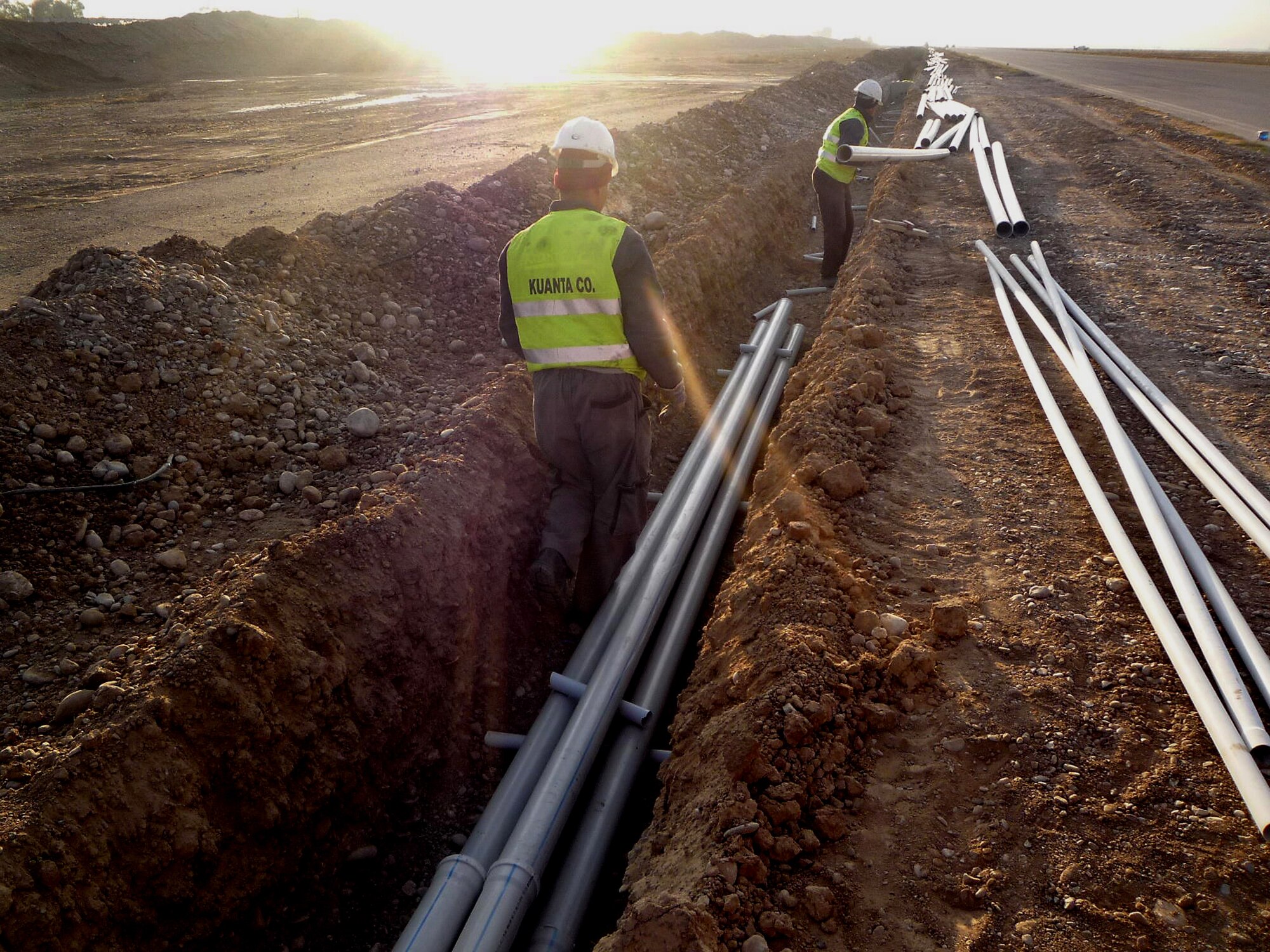 Contractors install conduit lines at Kirkuk Regional Air Base, Iraq, as part of a foreign military sales effort being managed by the Electronic Systems Center's 853rd Electronic Systems Group at Hanscom Air Force Base, Mass. (Courtesy photo)