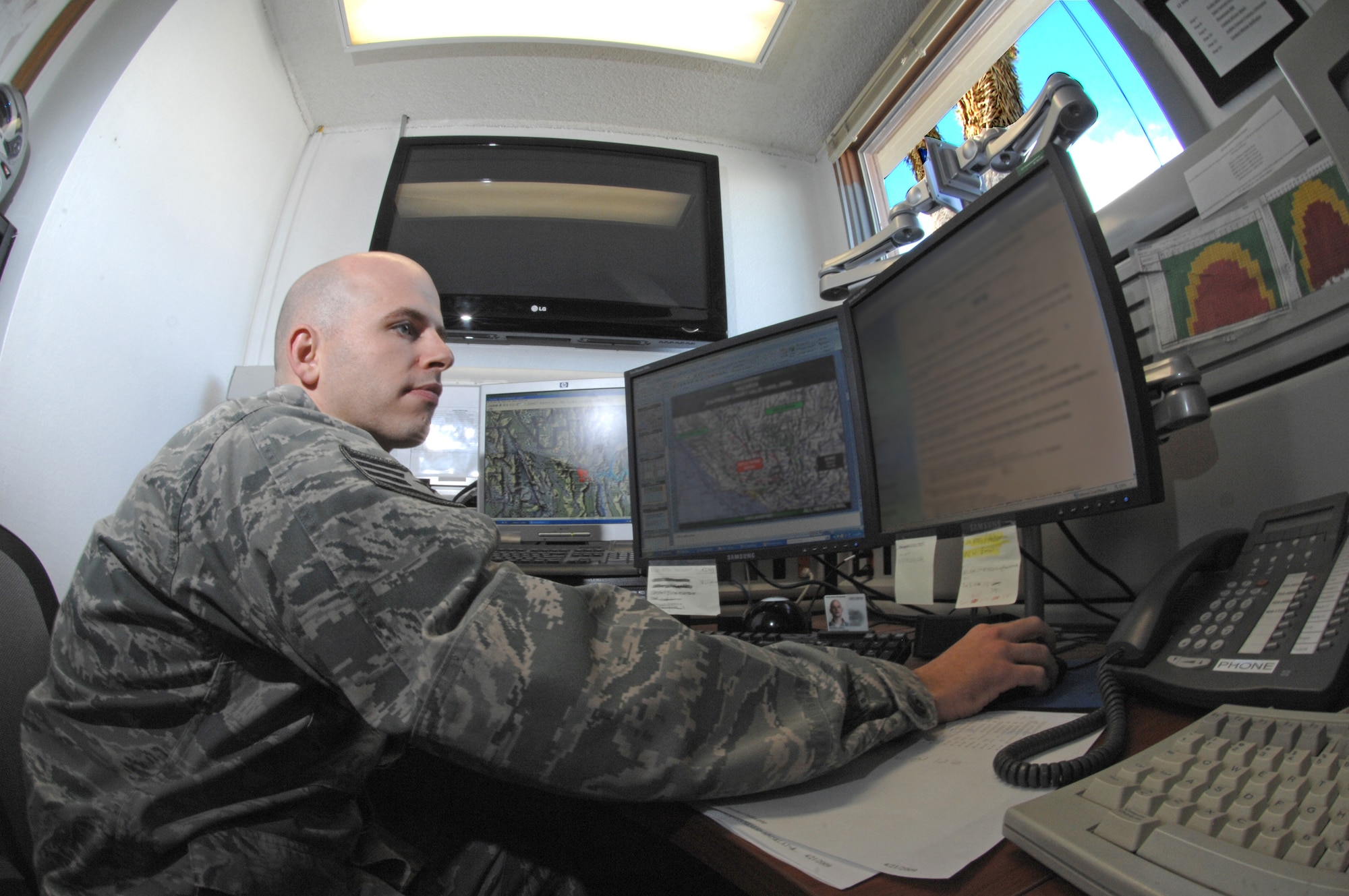 Staff Sgt. Cole Moreland produces mission execution forecasts and observing radars for flying missions April 22 at Creech Air Force Base, Nev. Sergeant Moreland is an unmanned aircraft systems weather forecaster assigned to the 432nd Operation Support Squadron Weather Flight. (U.S. Air Force photo/Senior Airman Larry E. Reid Jr.) 
