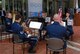 ALEXANDRIA, Va. - Members of the U.S. Air Force Band perform at the opening ceremony of the U.S. Patent and Trademark Office's 2009 Expo May 8. From top right:  Tech. Sgt. Karl Sweedy, Tech. Sgt. David Sisk, Master Sgt. Chris Quade, Tech. Sgt. Brett Miller and Tech. Sgt. Nathan Clark. The Air Force Trademark and Licensing Office became the first military service to showcase their trademarks at the annual event. (U.S. Air Force Photo/Jessica O'Haver)