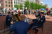 ALEXANDRIA, Va. - Members of the U.S. Air Force Band perform at the opening ceremony of the U.S. Patent and Trademark Office's 2009 Expo May 8. From top left:  Tech. Sgt. Karl Sweedy, Tech. Sgt. David Sisk, Master Sgt. Chris Quade, Tech. Sgt. Brett Miller and Tech. Sgt. Nathan Clark. The Air Force Trademark and Licensing Office became the first military service to showcase their trademarks at the annual event. (U.S. Air Force Photo/Jessica O'Haver)