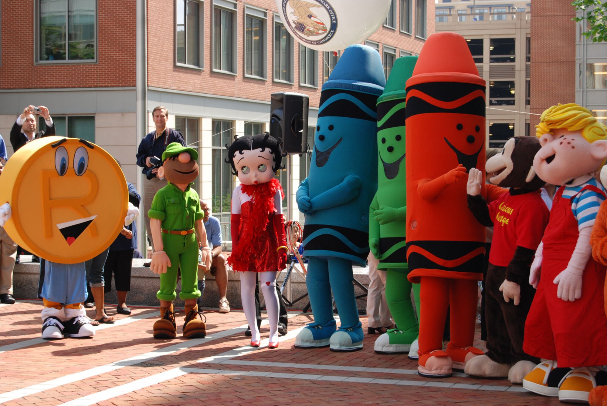 ALEXANDRIA, Va. - The 'Parade of Characters' enjoy their welcome at the U.S. Patent and Trademark Office's opening ceremony at the 2009 Expo May 8. The Air Force Trademark and Licensing Office was the first military branch to exhibit their trademarks at this event. The U.S. Air Force Band performed at the opening ceremony. (U.S. Air Force Photo/Jessica O'Haver)