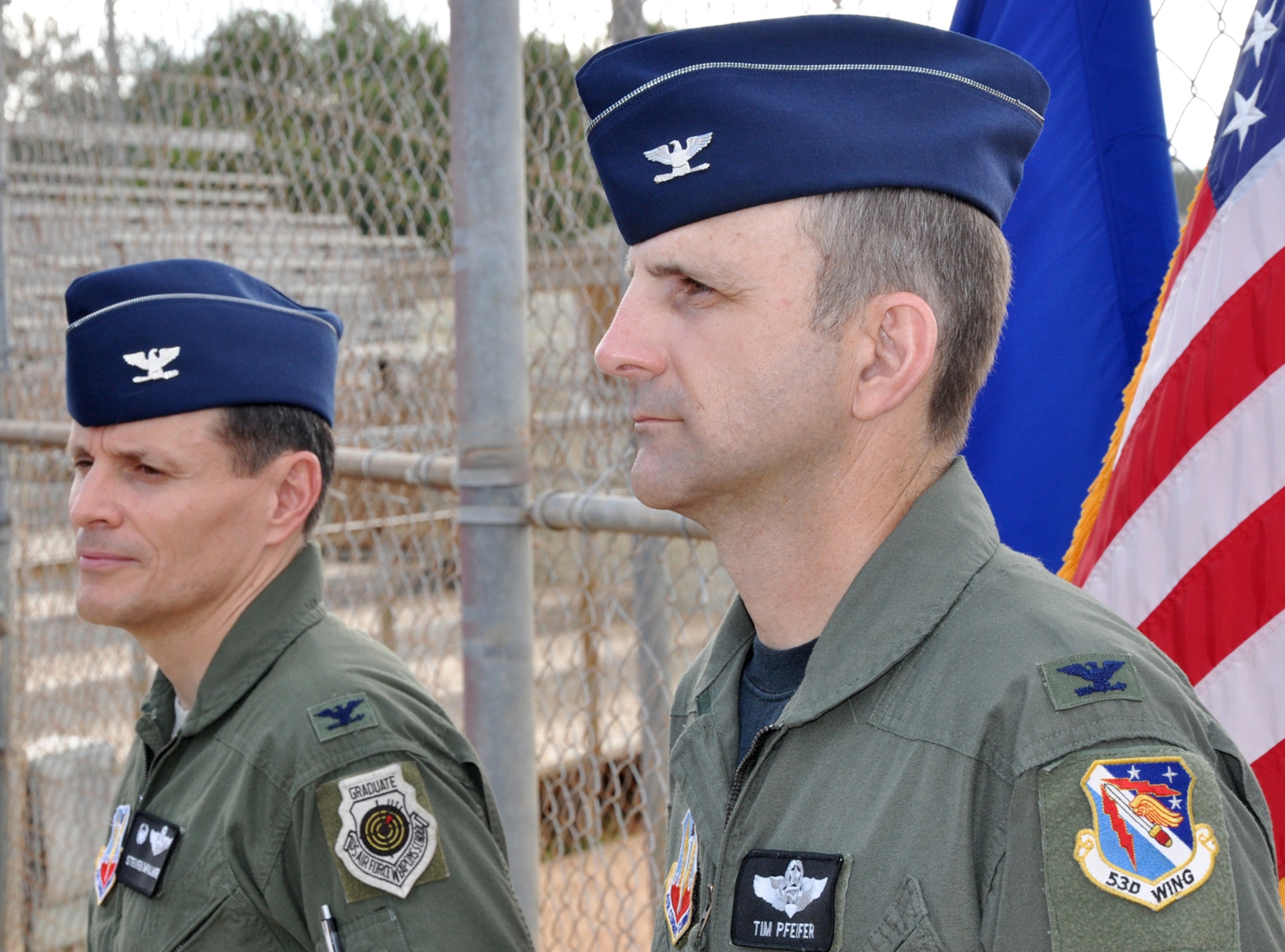Col. Tim Pfeifer, 53d Wing, stands by Col. Steve DePalmer, 53d Wing commander, as the order is read during Colonel Pfeifer’s bronze star presentation ceremony May 8 at Eglin Air Force Base.  The ceremony was held at Colonel DePalmer’s last commander’s call and was followed by a wing sports day.  U.S. Air Force photo/Airman Anthony Jennings.