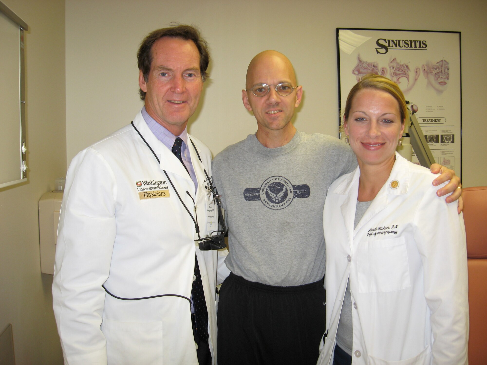 Master Sgt. Mike Sanders, center, with Dr. Bruce Haughey, left, and Resident Nurse Mandi Hickam, right.  Dr. Haughey was the lead surgeon that removed a racquetball-sized tumor from Sergeant Sander's neck in 2007. He was also on hand over a year later, in April, 2009, when Sergeant Sanders ran a half-marathon in St. Louis to celebrate being one year cancer-free. (Photo courtesy Master Sgt. Mike Sanders) 