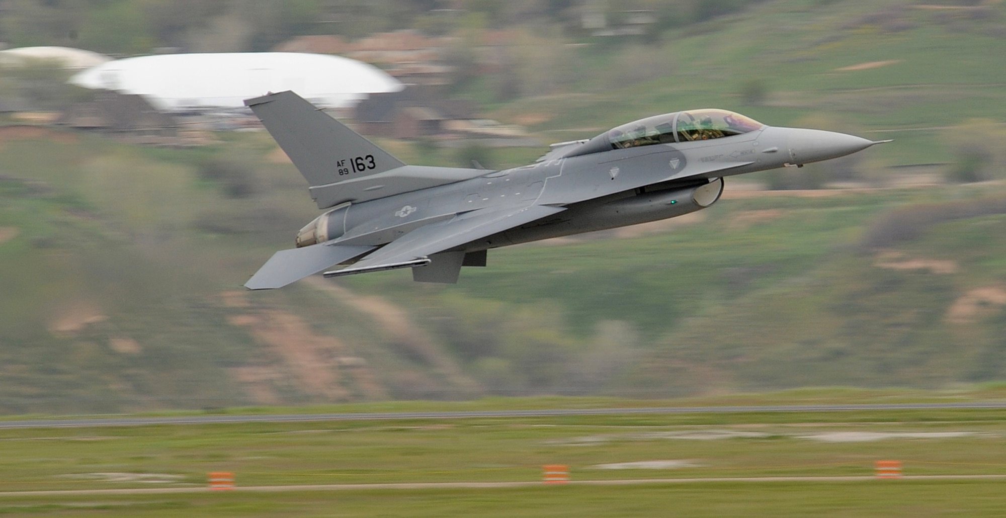An F-16 from Eglin Air Force Base, Fla., flies over Hill AFB, Utah during Combat Hammer, May 6. The Air-to-Ground Weapon Systems Evaluation Program is evaluating the accuracy of weapons systems of F-22A Raptor's from the 49th Fighter Wing at Holloman Air Force Base, N.M., as well as F-15's from Mountain Home AFB, Idaho and F-16's from Eglin AFB, Fla.   