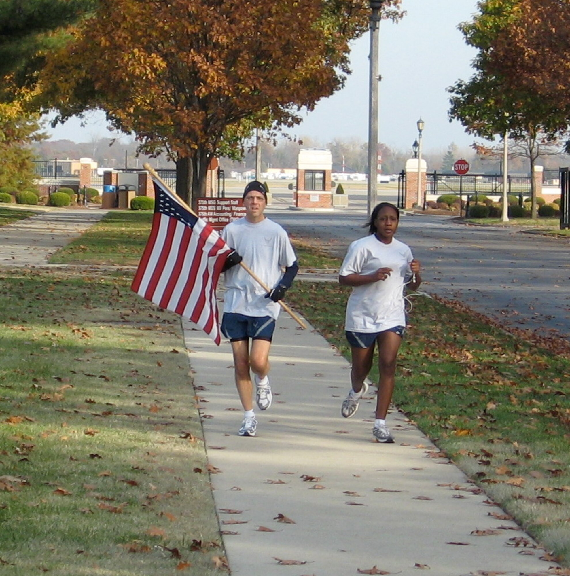 Master Sgt. Mike Sanders, left, takes part in a Veteran's Day vigil run on Scott Air Force Base, Ill., in late-2007.  He heard about the vigil and had worked up to running one mile after having surgery to remove stage IV cancer from his neck and throat. "I just wanted to run a leg of this event to honor our vets," said Sergeant Sanders while discussing the photo.  (Photo courtesy Master Sgt. Mike Sanders)