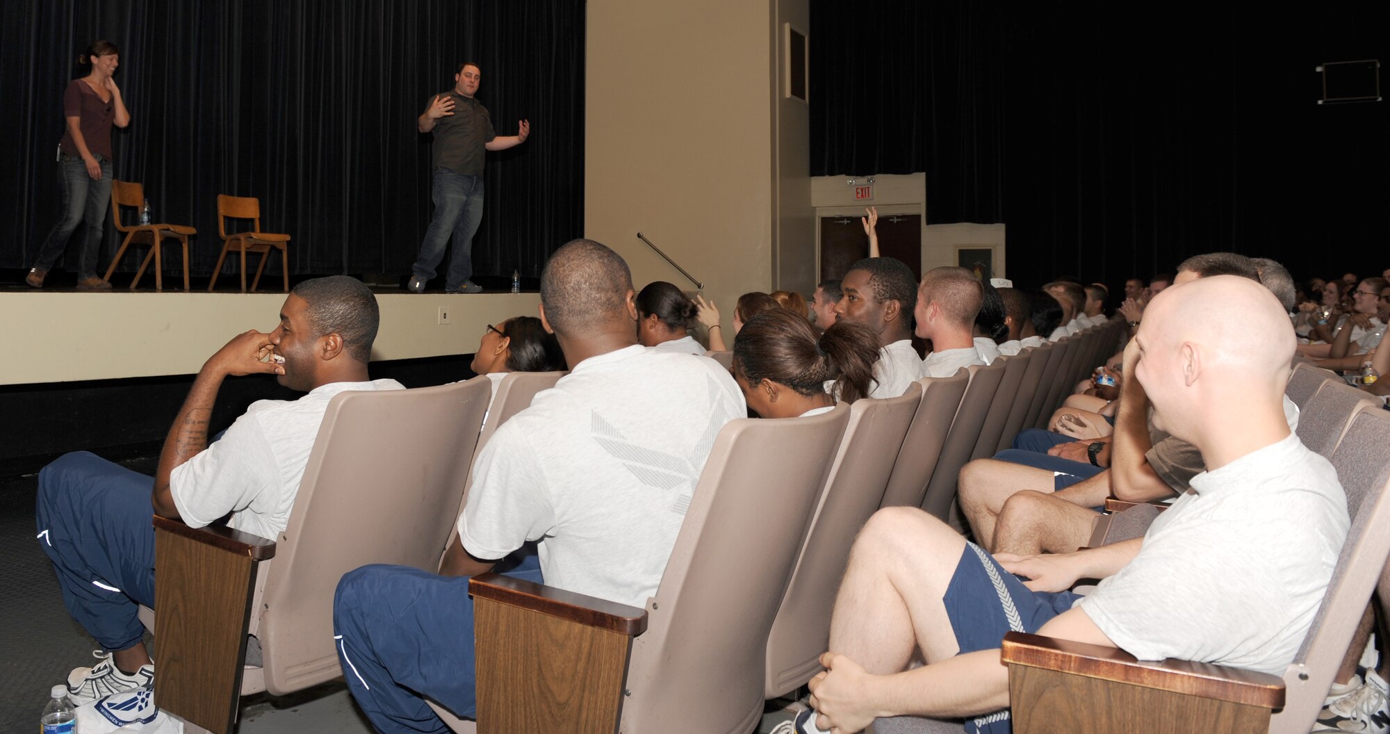 Airmen watch as Amber Kelly and George Gianappolis, actors from Catharsis Productions, perform Sex Signals at the theatre on Seymour Johnson Air Force Base, N.C., May 8, 2009. The objective of the play was to raise sexual-assault awareness for Airmen as part of the 4th Fighter Wing's Wingman Warrior day. (U.S. Air Force photo by Airman 1st Class Gino Reyes)