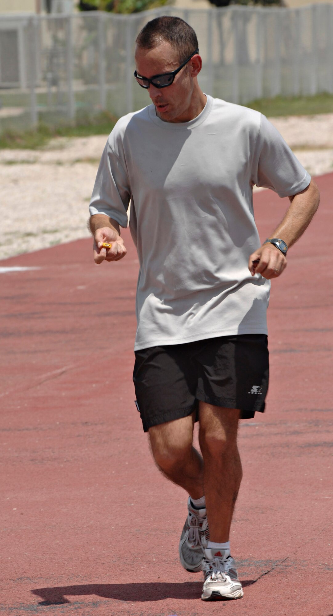 Capt. Theodore Rieth, 39th Air Base Wing sexual assault response coordinator, marks a lap on his hand held counter as he runs in the Relay for Life at the Incirlik running track, May 9, 2009. Captain Rieth was a member of the Team WSA and ran and walked 50 miles for the relay. The 2009 Relay for Life was the first relay available to members of the Incirlik community and hosted more than 300 participants from 20 teams, raising more than $9,500. The event lasted 12 hours and included a luminaria ceremony in which participants wrote the names of cancer survivors and victims on more than 100 luminary bags. (U.S. Air Force photo/Senior Airman Benjamin Wilson)