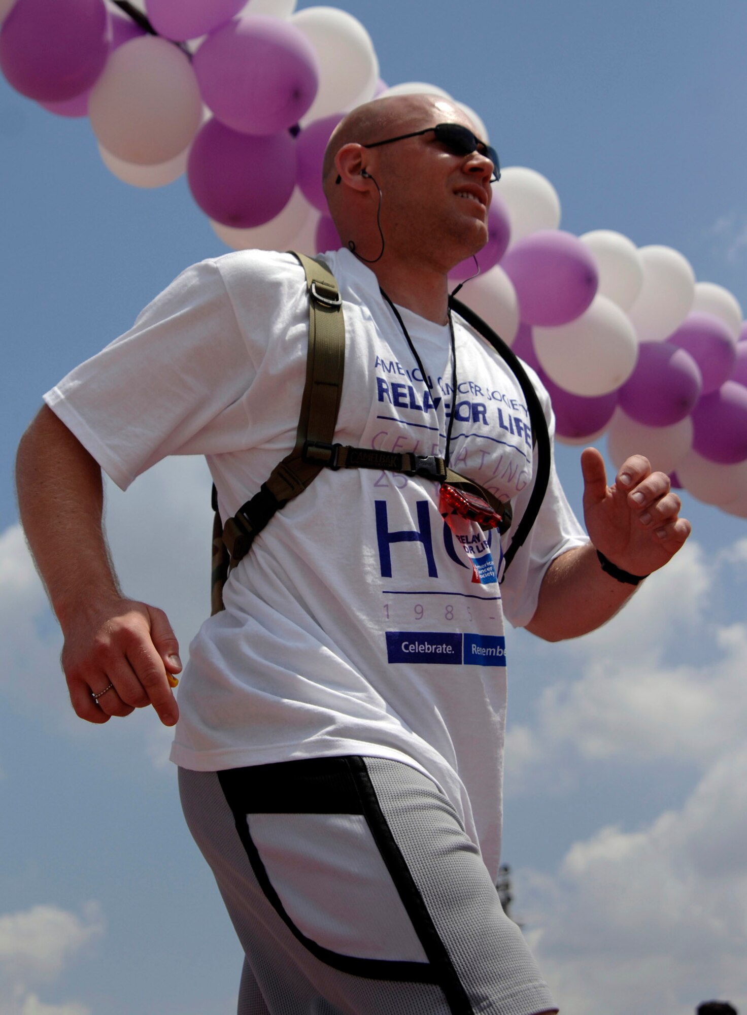 Staff Sgt. Joseph Gibbon, 39th Air Base Wing chapel, crosses the check point during the Relay for Life at the Incirlik running track, May 9, 2009. The 2009 Relay for Life was the first relay available to members of the Incirlik community and hosted more than 300 participants from 20 teams, raising more than $9,500. The event lasted 12 hours and included a luminaria ceremony in which participants wrote the names of cancer survivors and victims on more than 100 luminary bags. (U.S. Air Force photo/Senior Airman Benjamin Wilson)