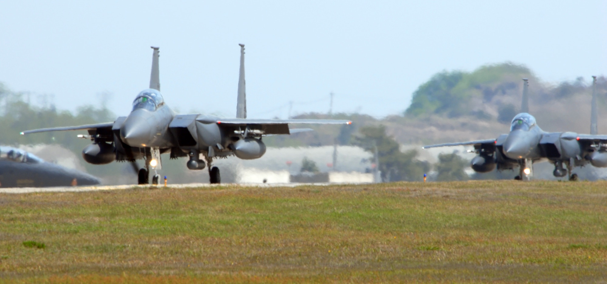 KUNSAN AIR BASE, Republic of Korea -- Two F-15K Slam Eagles taxi the runway before take off during exercise Max Thunder 09-01 at Kunsan Air Base, May 11. The second annual Max Thunder exercise is a 7th Air Force-designed, bi-lateral training opportunity that aims to test aircrews’ war-fighting skills in realistic combat situations that combine both Republic of Korea Air Force and U.S. Air Force flying and maintenance personnel.Photo/Senior Airman Gustavo Gonzalez)