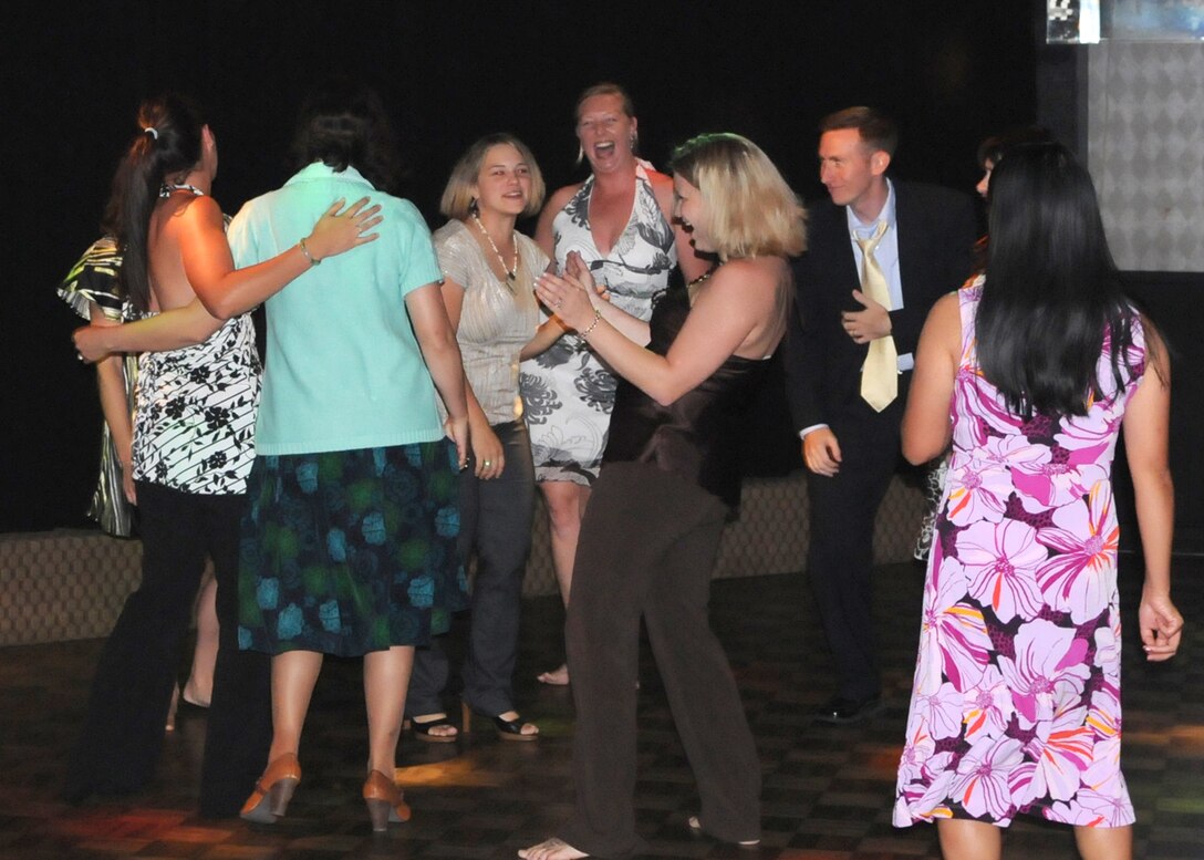 KADENA AIR BASE, Japan -- Attendees of the 353rd Special Operations Group "Evening of Appreciation" dance at the Kadena Officers' Club here May 9. More than 50 members of the group gathered to celebrate and honor military spouses for their daily contributions and selfless sacrifice supporting the military members. The event featured live music, guest speakers, dinner and dancing. (U.S. Air Force photo by Tech. Sgt. Aaron Cram)