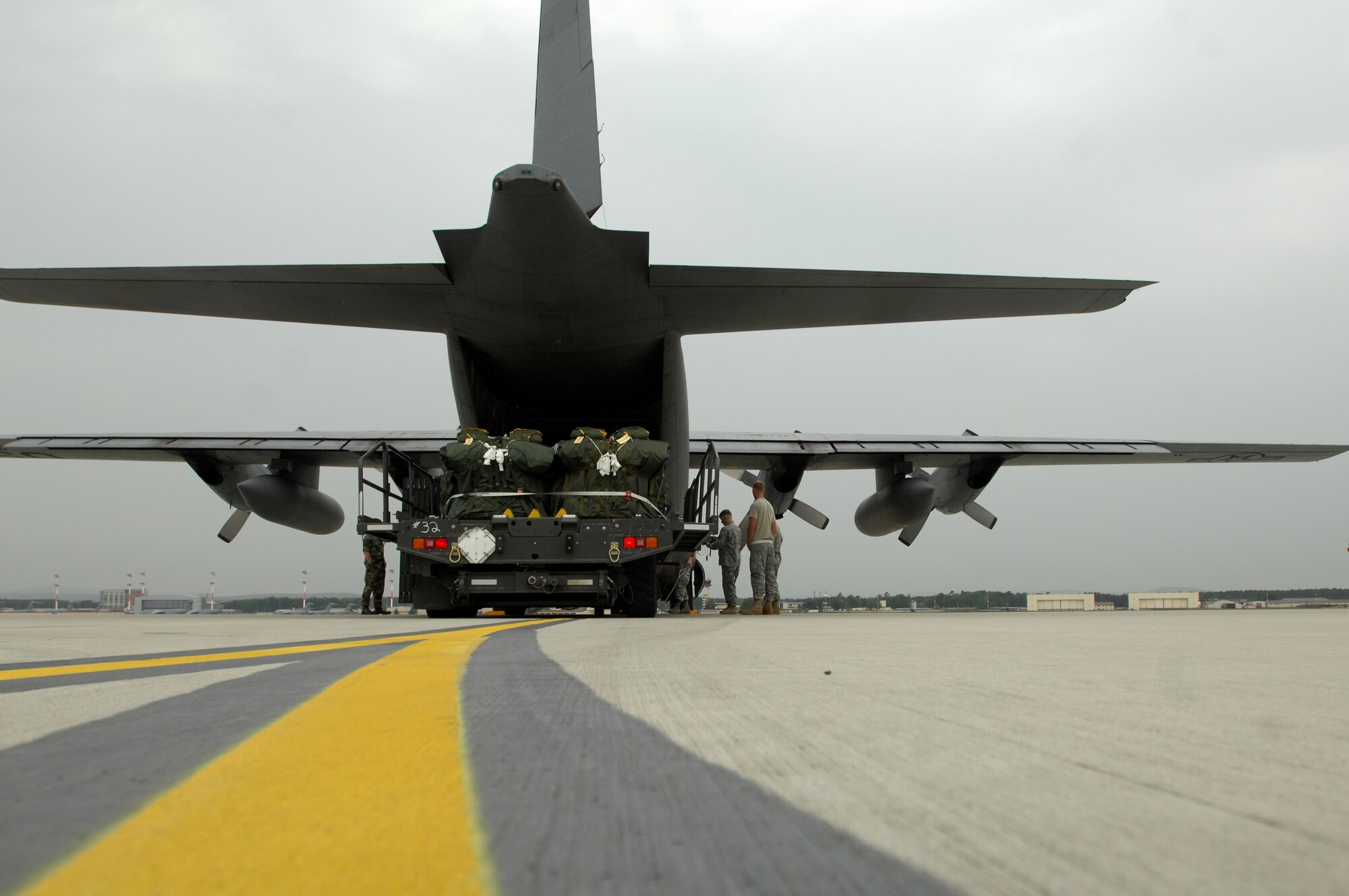 United States Air Force members with the 1st Combat Communication Squadron and 37th Airlift Squadron prepare to load life saving equipment onto a Ramstein C-130 Hercules, May 9, 2009, in support of NASA, in its launch of the space shuttle Atlantis scheduled for May 11, 2009. (U.S. Air Force photo by Senior Airman Kenny Holston)