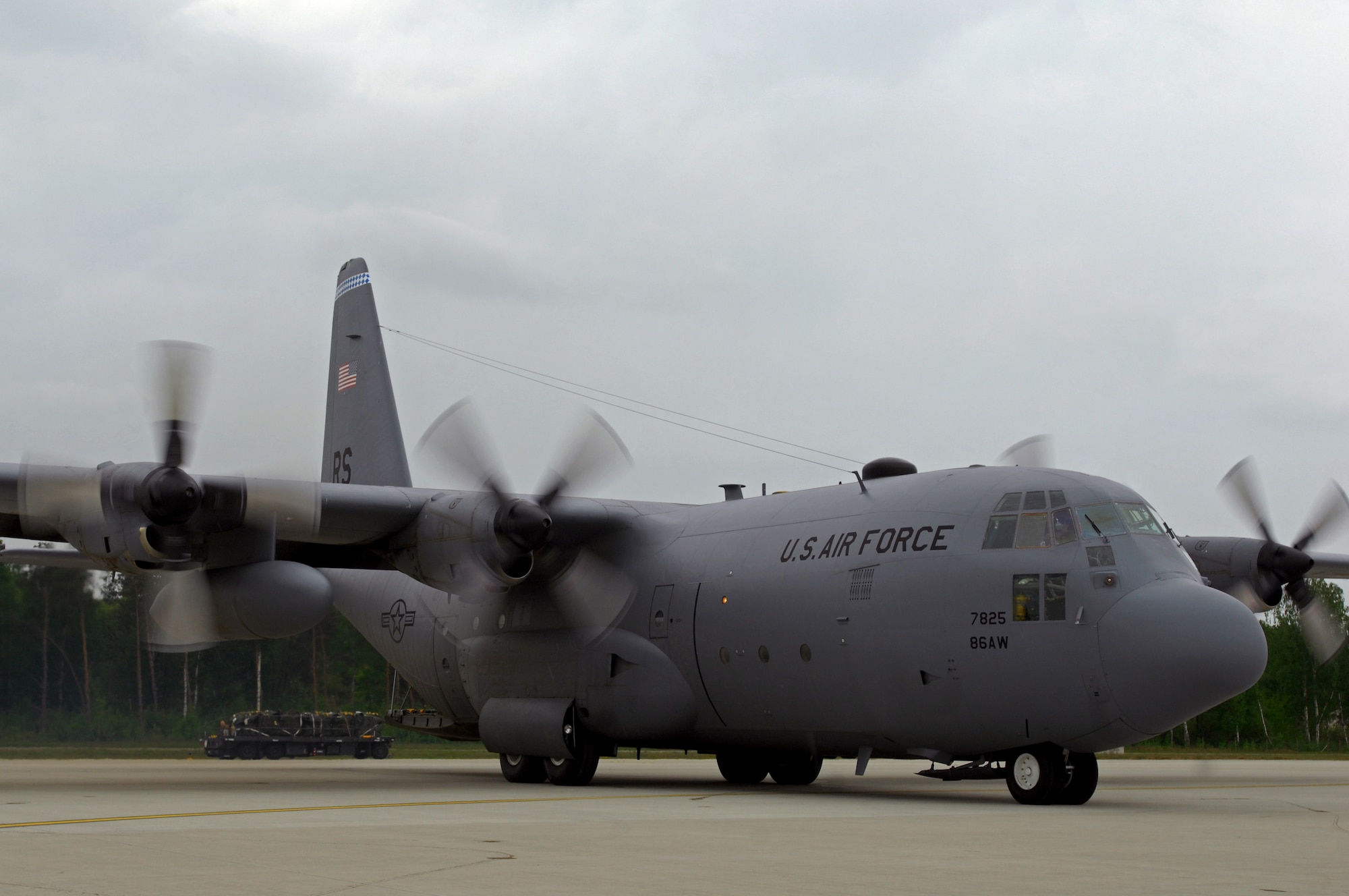 A United States Air Force C-130 Hercules from Ramstein Air Base, Germany, taxies onto the hot cargo pad, May 9, 2009, in preparation to be loaded with life saving equipment, in support of NASA in its launch of the space shuttle Atlantis scheduled for May 11, 2009. (U.S. Air Force photo by Senior Airman Kenny Holston)
