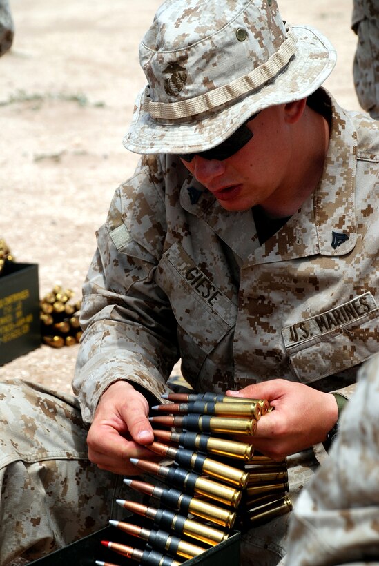 U.S. Marine Corps Cpl. Dane P. Giese counts his ammunition prior to firing the M2 .50 caliber machine gun during Exercise African Lion 2009 in Tifnit, Morocco, May 6, 2009. 