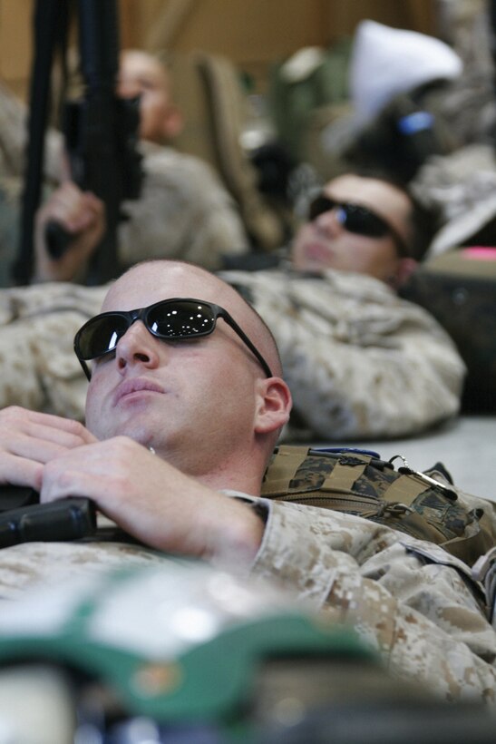 Sgt. Matthew Grogan, Marine Attack Squadron 214 maintenance controller, takes a rest while waiting for the Blacksheep’s flight to southern Afghanistan May 10, 2009 in the squadron’s hangar. Grogan, a Denver native, and 90 other Marines left May 10, 2009 for a deployment slated to last between six and twelve months.
