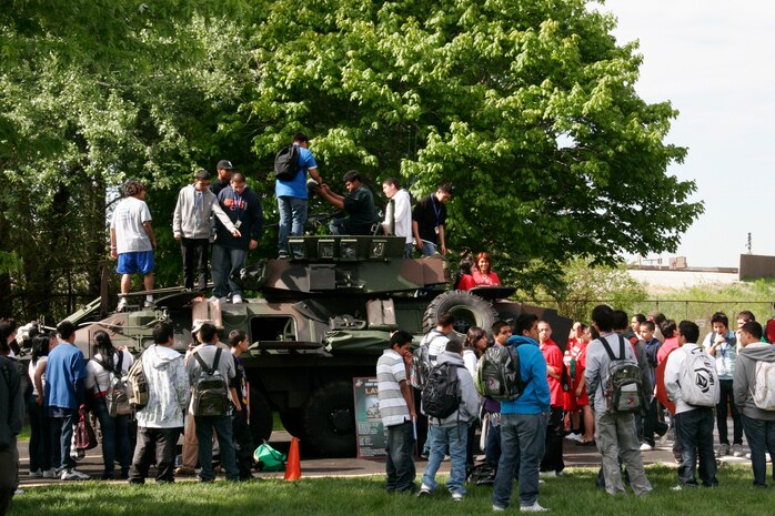 Marie Curie High School students got in and around the Marine Corps' Light Armored Vehicle-25A2 armored personnel carrier during a static display at Marie Curie High School May 11. The static display at Chicago's second largest high school was one of the first events of the inaugural Marine Week Chicago. Marine Week Chicago, which runs from May 11-17, is an opportunity for Chicago citizens to meet the men and women of the Marine Corps and learn about its history, traditions and value to the nation.