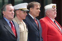 VIPs stand for the presentation of the colors at the Marine Week Dedication Ceremony.