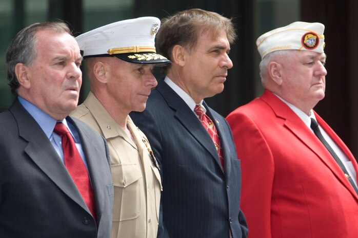 VIPs stand for the presentation of the colors at the Marine Week Dedication Ceremony.