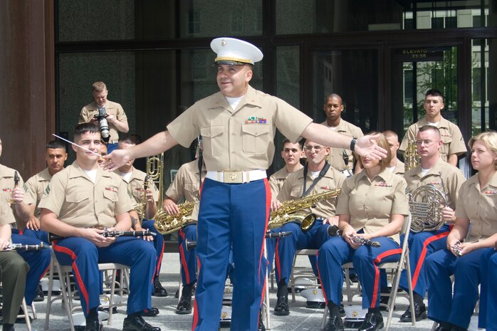 Chief Warrant Officer 2 Stephen B. Giove,  Band Officer for the 29 Palms Marine Band, introduces his unit to the crowd at the Marine Week Dedication Ceremony.