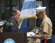 A Marine with Chemical Biological Incident Response Force, II Marine Expeditionary Force, gazes at a picture of Lt. Gen. “Chesty" Puller; who is the only Marine to receive five Navy Crosses. CBIRF was awarded the Lieutenant General “Chesty” Puller Outstanding Leadership Award here, May 11, recognizing their achievement in combat readiness.