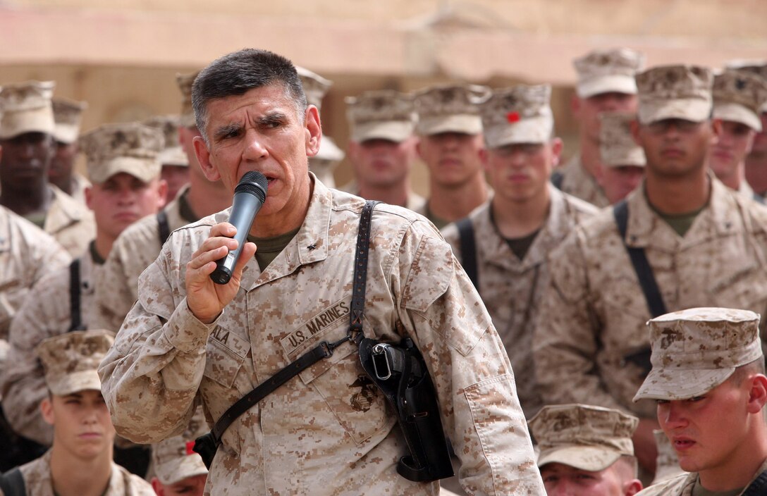 Brig. Gen. Juan G. Ayala, the 2nd Marine Logistics Group (Forward) commanding general, speaks to the Marines and sailors of Combat Logistics Battalion 4, 2nd MLG (Fwd), at Camp Ramadi, Iraq, May 12, 2009. Ayala made the trip to present several awards to the Marines and sailors of CLB-4 and to tour the battalion’s assets on the base.