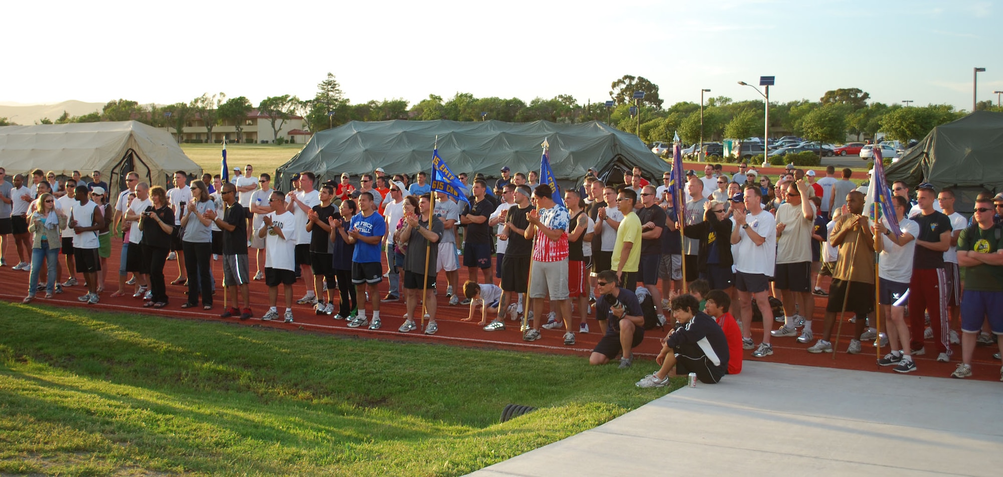 Viking Challenge participants await the awards presentation during the event’s closing ceremonies May 9.  More than 300 people participated in the 12-hour relay, which is the Travis Fisher House’s largest fundraiser each year. (U.S. Air Force photo/1st Lt. Nicole Langley)