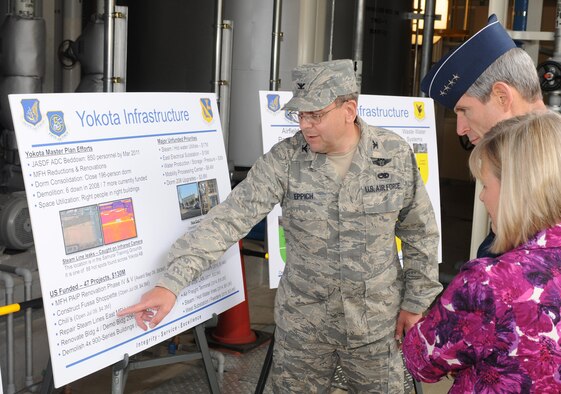 Col. Frank Eppich, 374th Airlift Wing vice commander, briefs Gen. Norton Schwartz, Air Force Chief of Staff, and his wife Suzie, on current and future construction projects at Yokota Air Base, Japan, May 12 during a visit to the base's East Side Steam Plant. General Schwartz toured base facilities and met with key U.S. Forces Japan and 5th Air Force officials during his first visit to the base since he became Chief of Staff. (U.S. Air Force photo/Airman 1st Class Devin Doskey) 