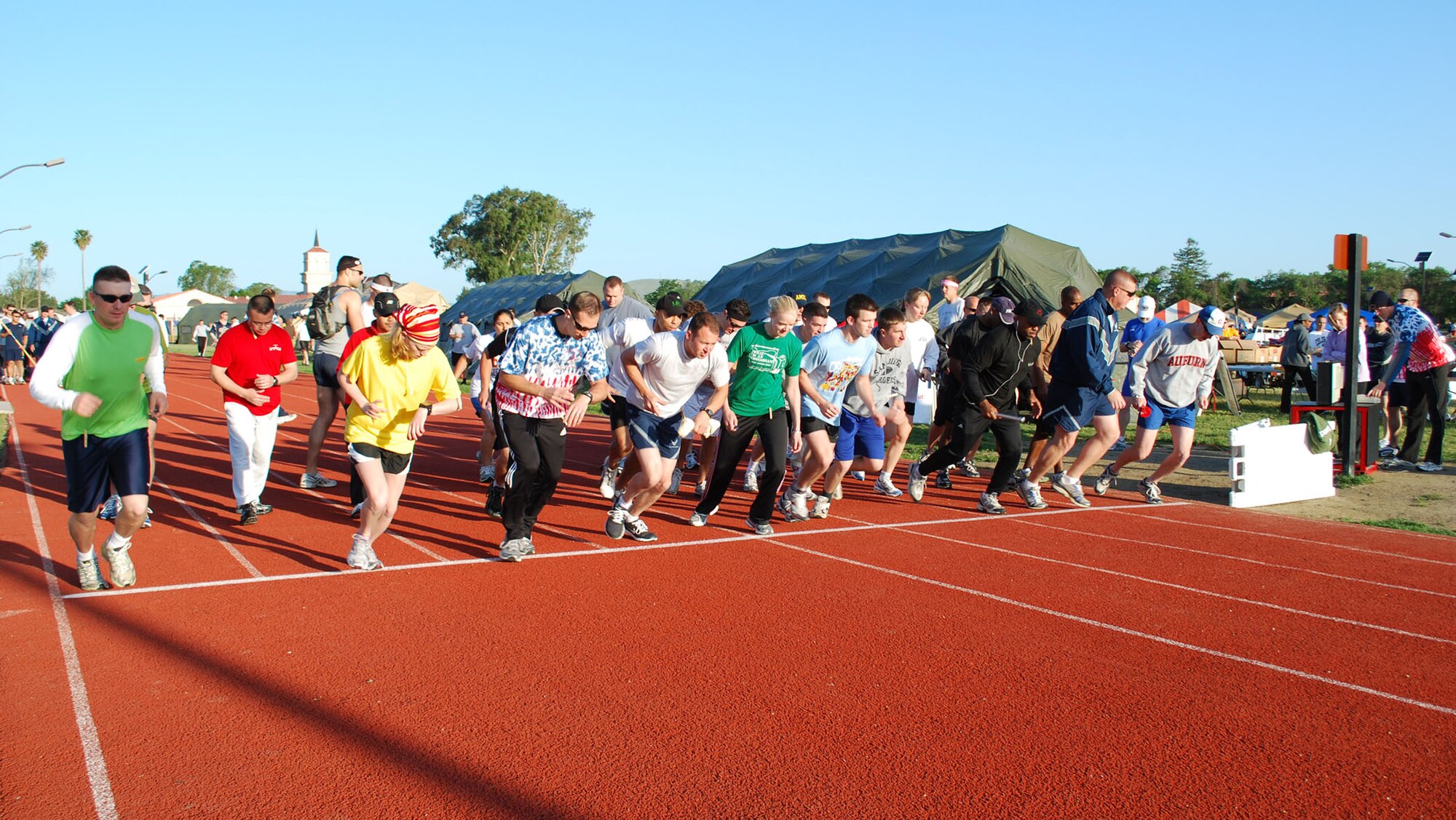 Thirty six runners take their first steps off the starting line at Viking Challenge held at the Fitness Center track May 9.  Viking Challenge, an annual 12-hour relay event, is the Travis Fisher House’s largest fundraiser.  This year’s Viking Challenge broke the record as the largest in event history with 321 participants competing on 36 teams. (U.S. Air Force photo/1st Lt. Nicole Langley)