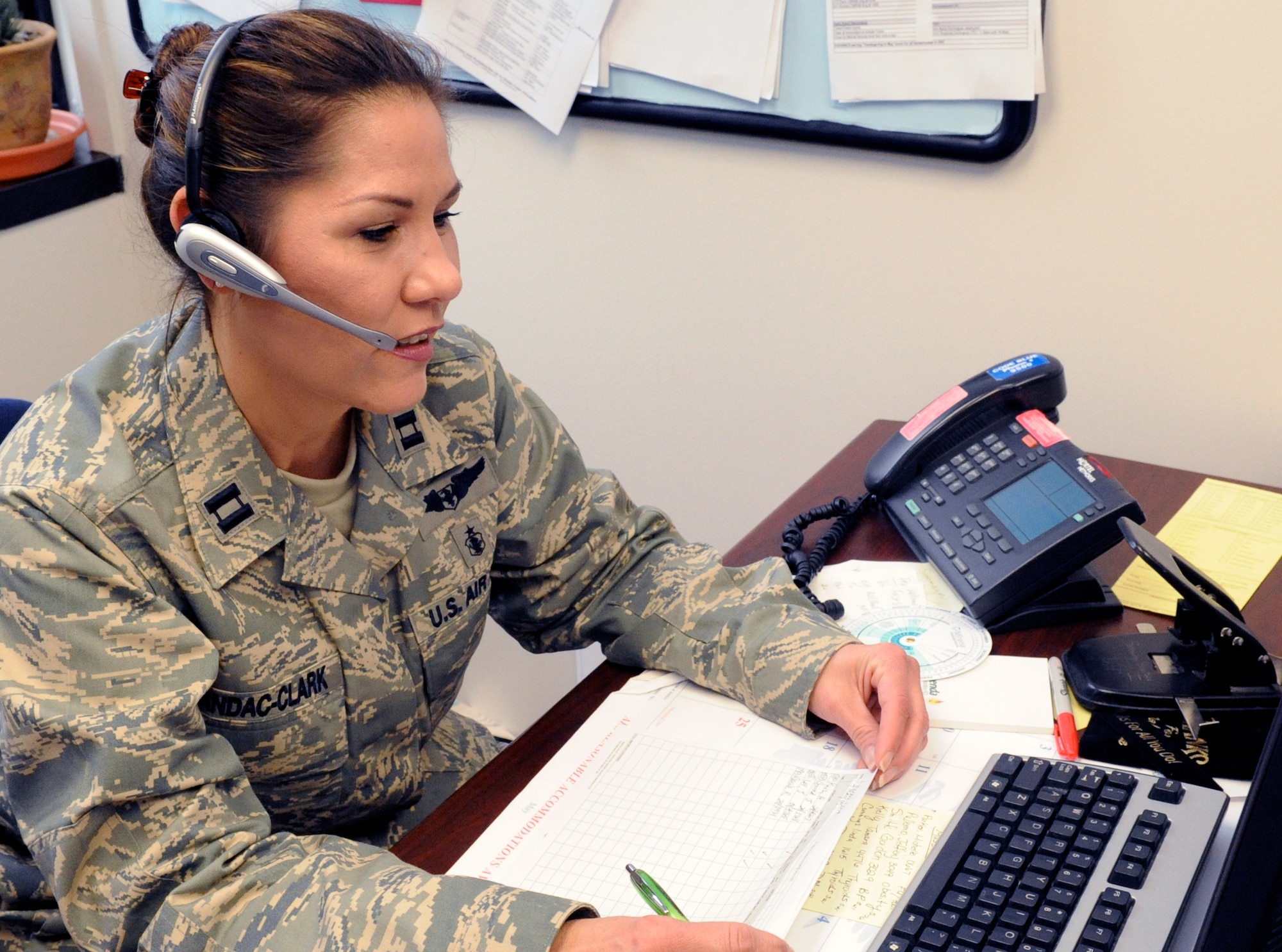 A clinical nurse, Captain Cynthia Mandac-Clark, of the 87th Medical Group's Family Practice section, uses telecommunication technologies to manage her patients' health care needs. Captain Mandao-Clark is one of many nurses being recognized during National Nurses Week. (U.S. Air Force photo/Wayne Russell)