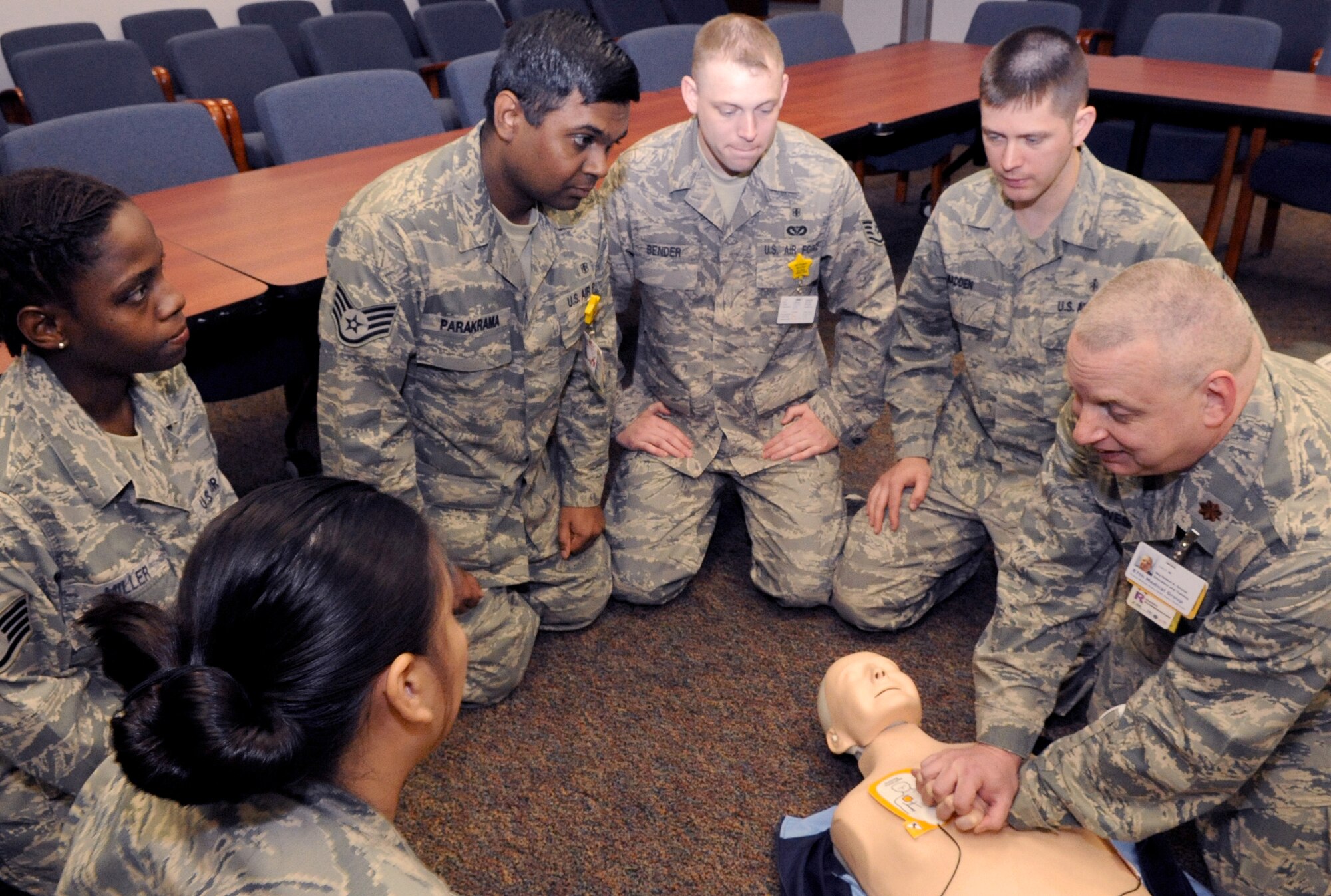 Maj. Robert Groves, right, 87th Medical Group Education and Training Flight Commander, demonstrates the proper technique for chest compressions and use of the Automated External Defibrillator during a Basic Life Skills class for nurse technicians on May 7 at the Medical Center on McGuire Air Force Base. The enlisted medical technicians were recently honored during national Nurses Appreciation Week held May 6 to 12. (U.S. Air Force photo/Wayne Russell)