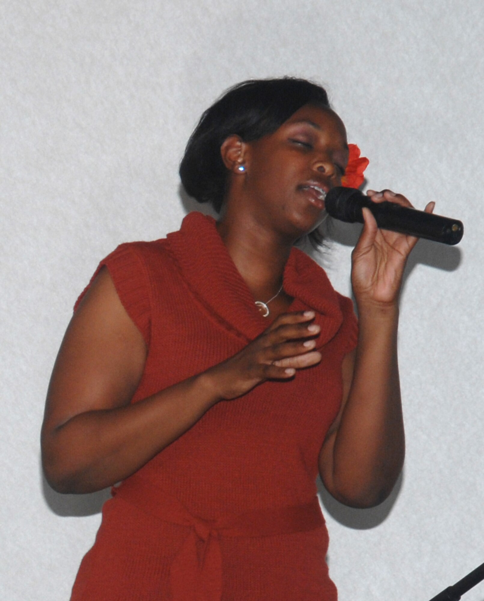 Airman 1st Class Megan Harvey, 2d Maintenance Squadron, displayed her gift of singing at the talent show sponsored by the First Four Airman Association April 25 at the Stripes Lounge. Airman Harvey was awarded first place at the event. (Senior Airman Alyssa Miles/U.S. Air Force photo)