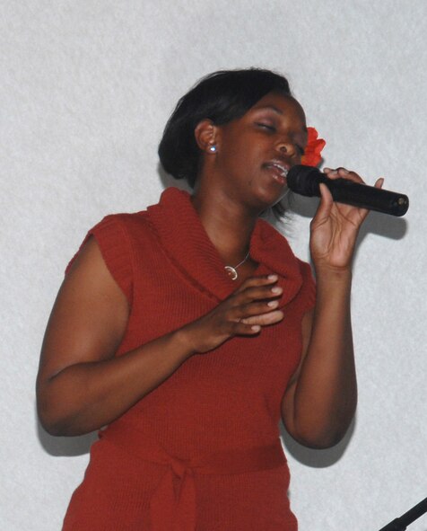 Airman 1st Class Megan Harvey, 2d Maintenance Squadron, displayed her gift of singing at the talent show sponsored by the First Four Airman Association April 25 at the Stripes Lounge. Airman Harvey was awarded first place at the event. (Senior Airman Alyssa Miles/U.S. Air Force photo)